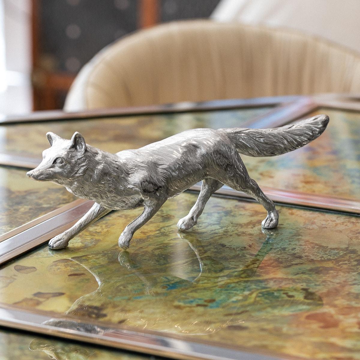 Antique early-20th Century German solid silver table ornament, realistically cast as a prowling fox, with ears pricked and eyes wide open. Hallmarked English import silver (925 standard), London, year 1911 (q), Importer ABD (Adolph Barsach