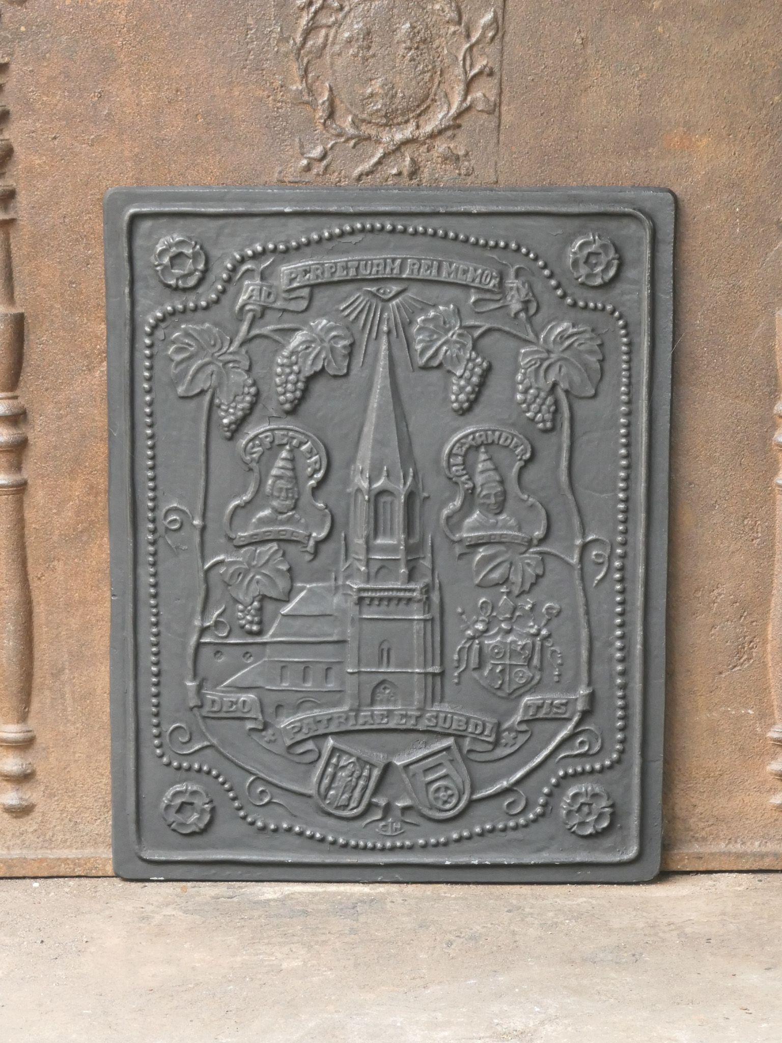 20th-Century German Victorian Style fireback with a religious theme. The fireback is made of cast iron and is black. The condition is good, no cracks.