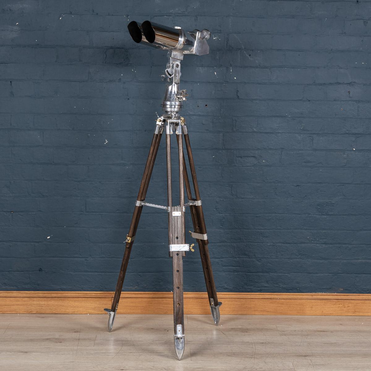 Exceptional 20th century WWII German Joseph Schneider Steel observation telescope binoculars on a later telescopic stand. This model was originally designed by Emil Busch and it has been adopted by the military in 1936. The model is suitable for