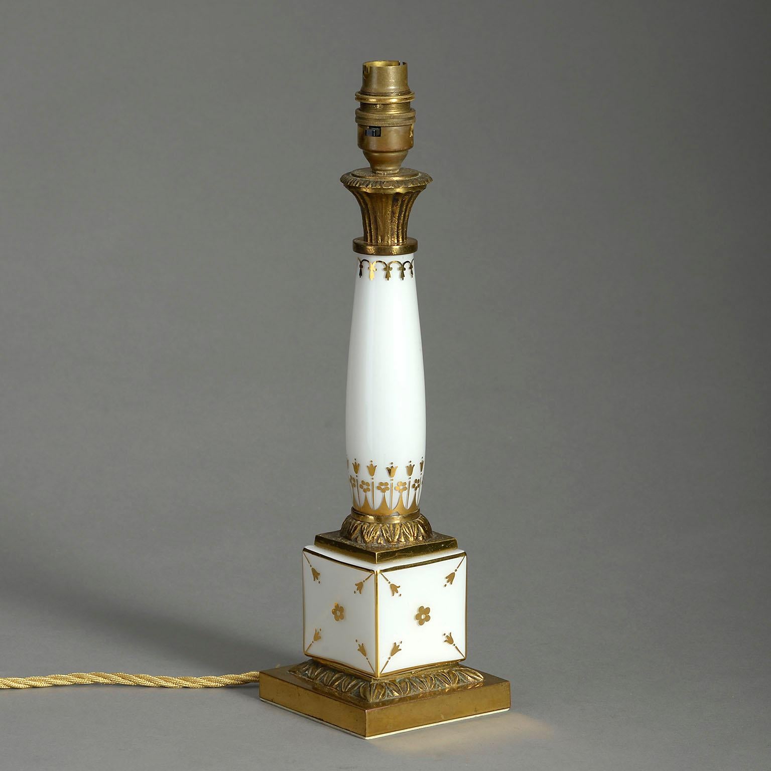 A mid-twentieth century Pairs porcelain column lamp in the Classical taste, with gilded decoration and ormolu mounts.

Display shade not included.

Listed height dimensions do not include electric bulb holder.