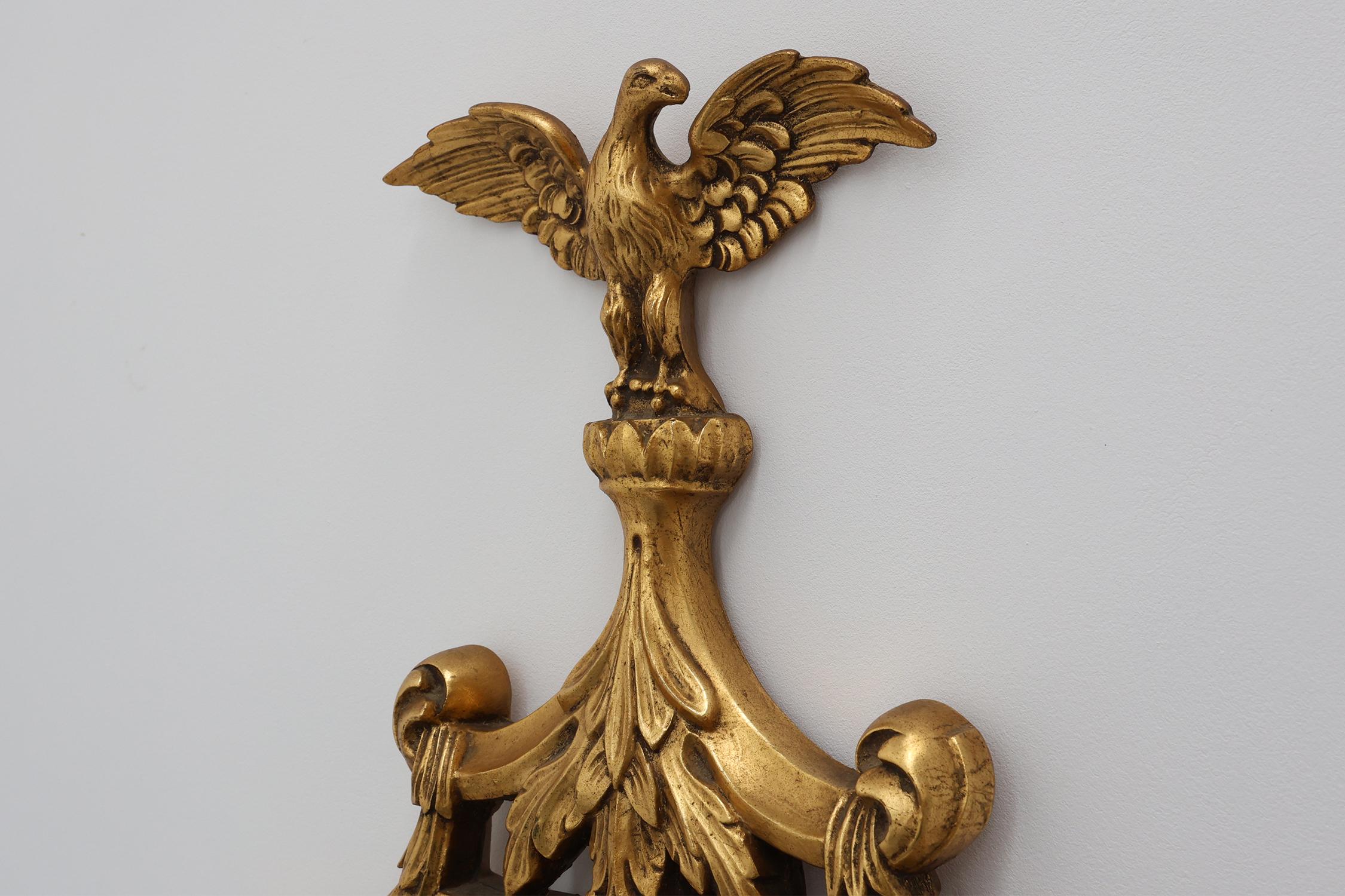 20th Century gilded wooden Empire style mirror with eagle on top in vendita 1