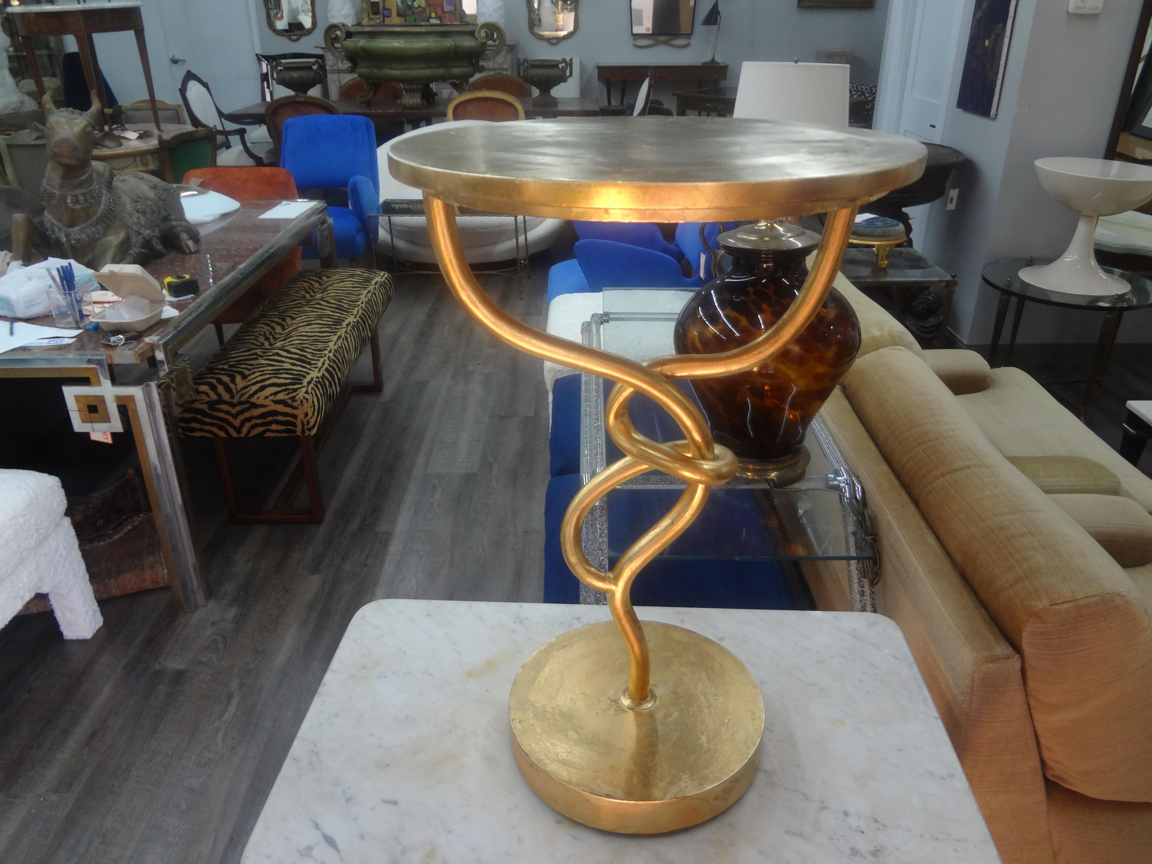 20th Century Gilt Iron Knot Table. Our stunning post modern Roche Bobois style gilt knot table, possibly French has a great sculptural look and is the perfect side table, lamp table or pedestal for a bust or sculpture.