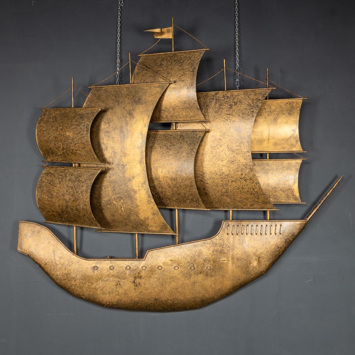 Stunning 20th century large piece of wall art in a shape of a galleon with full blown sails in gilded metal. A superb piece of decorative art that will look great in any interior.

Condition
In great condition - No Damage.

Size
Height: