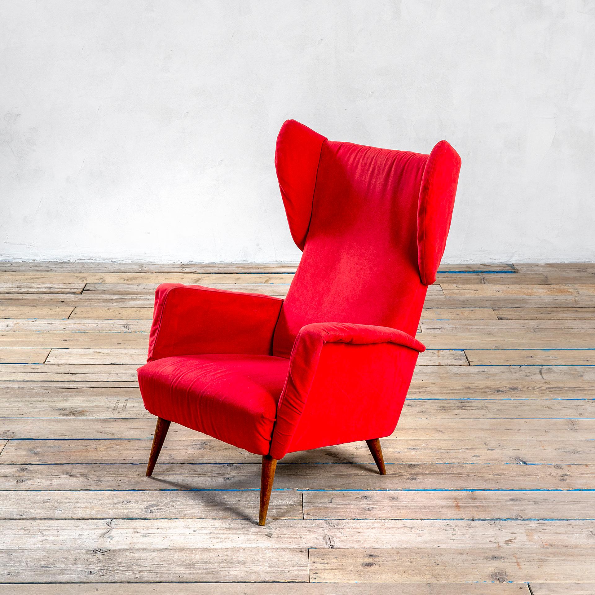 Wonderful armchair designed by Gio Ponti for Cassina in '50s. The armchair has a wooden structure with 4 wooden feet, and fabric upholstery. The model of the armchair remembers a kind of bergere, but its style is in definitive more modern. This
