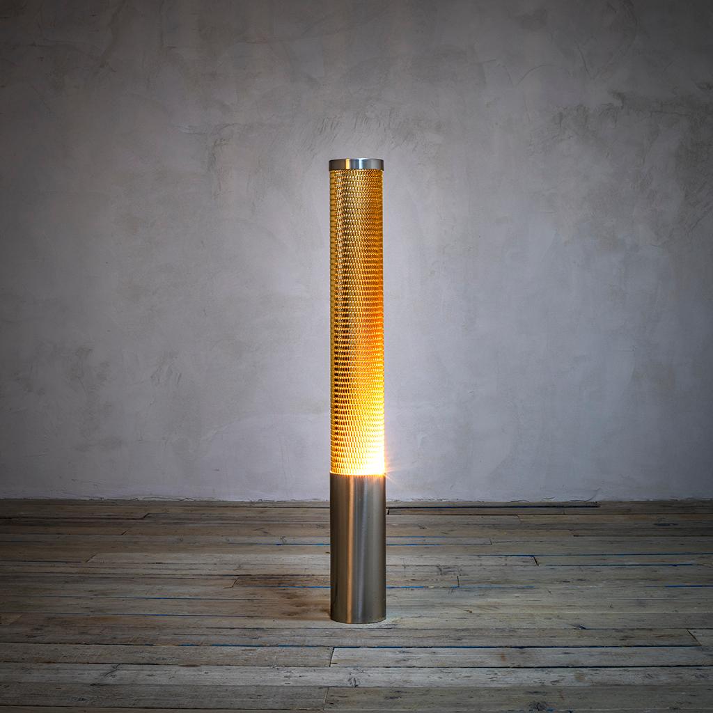 Very beautiful Floor Lamp designed by Gio Ponti in '70s for Reggiani. The floor lamp has a very simple geometric line, it is as a cylinder with its base and its top in steel, and the diffuser is entirely in perforated Aluminium colored in orange -