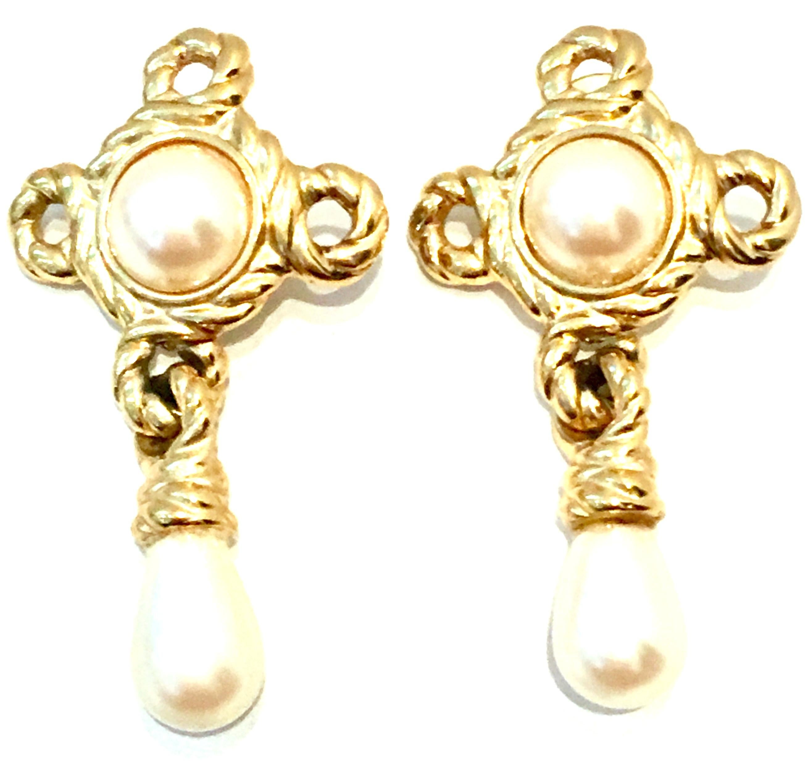 20th Century Givenchy Pair Of Gold Plate & Faux Pearl Drop Earrings. These finely crafted pierced style earrings feature gold plate with faux freshwater pearl stones. The teardrop shape pearl stone measures approximately, .5