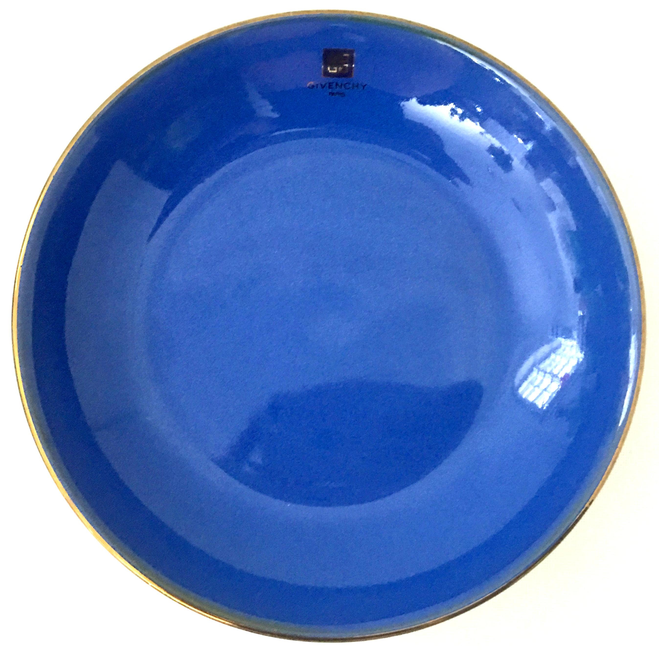 20th century Givenchy Paris porcelain cobalt enamel & 22k gold bowl. Features a vivid cobalt base with a 22K gold rim. Can be used as a serving and or decorative bowl. Givenchy Paris logo appears on front of piece. Signed on the underside,