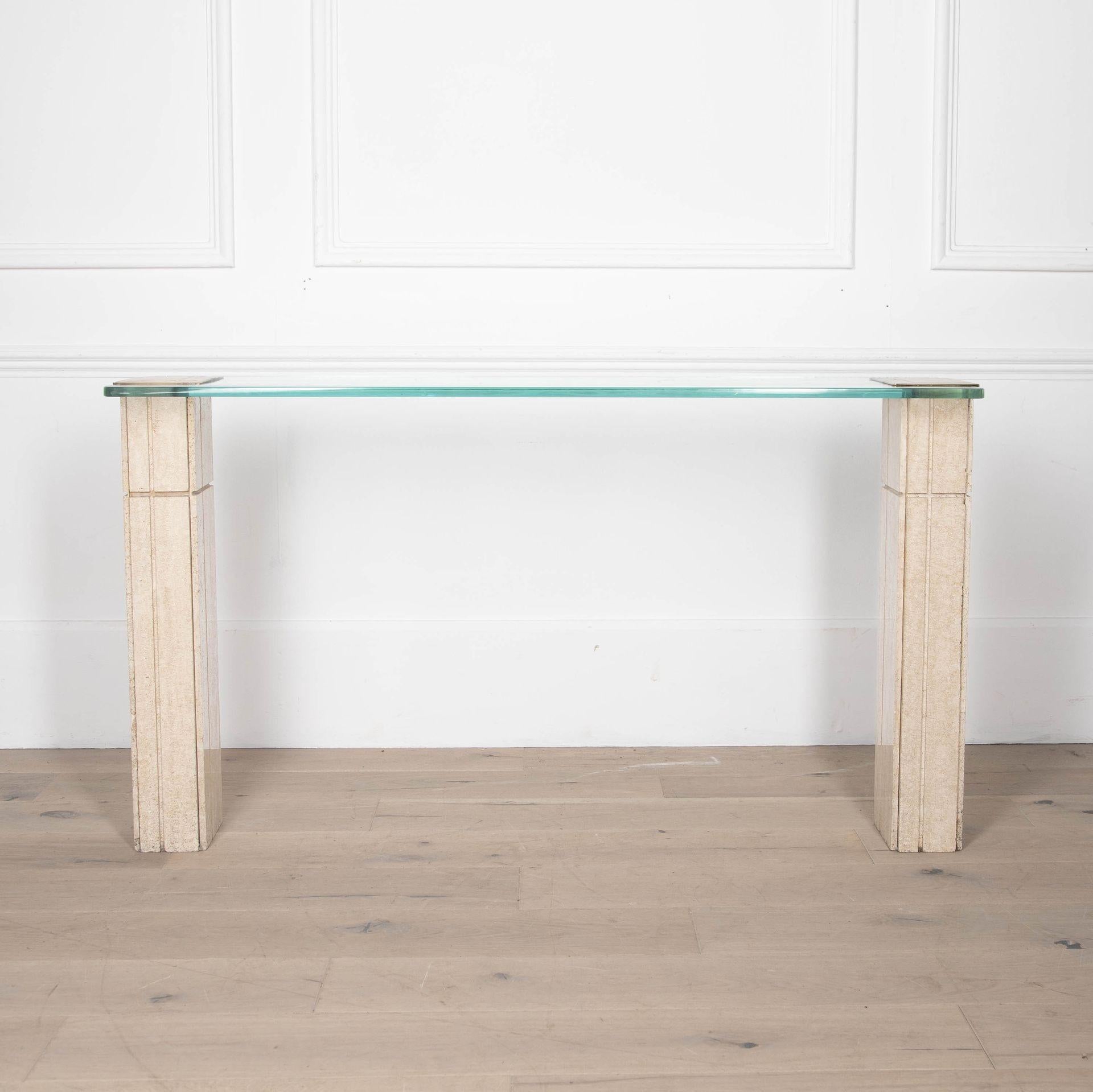 Mid-Century Italian elegant and narrow travertine, glass and brass console table.
Travertine is an organic material which is very much in fashion.
Circa 1970.