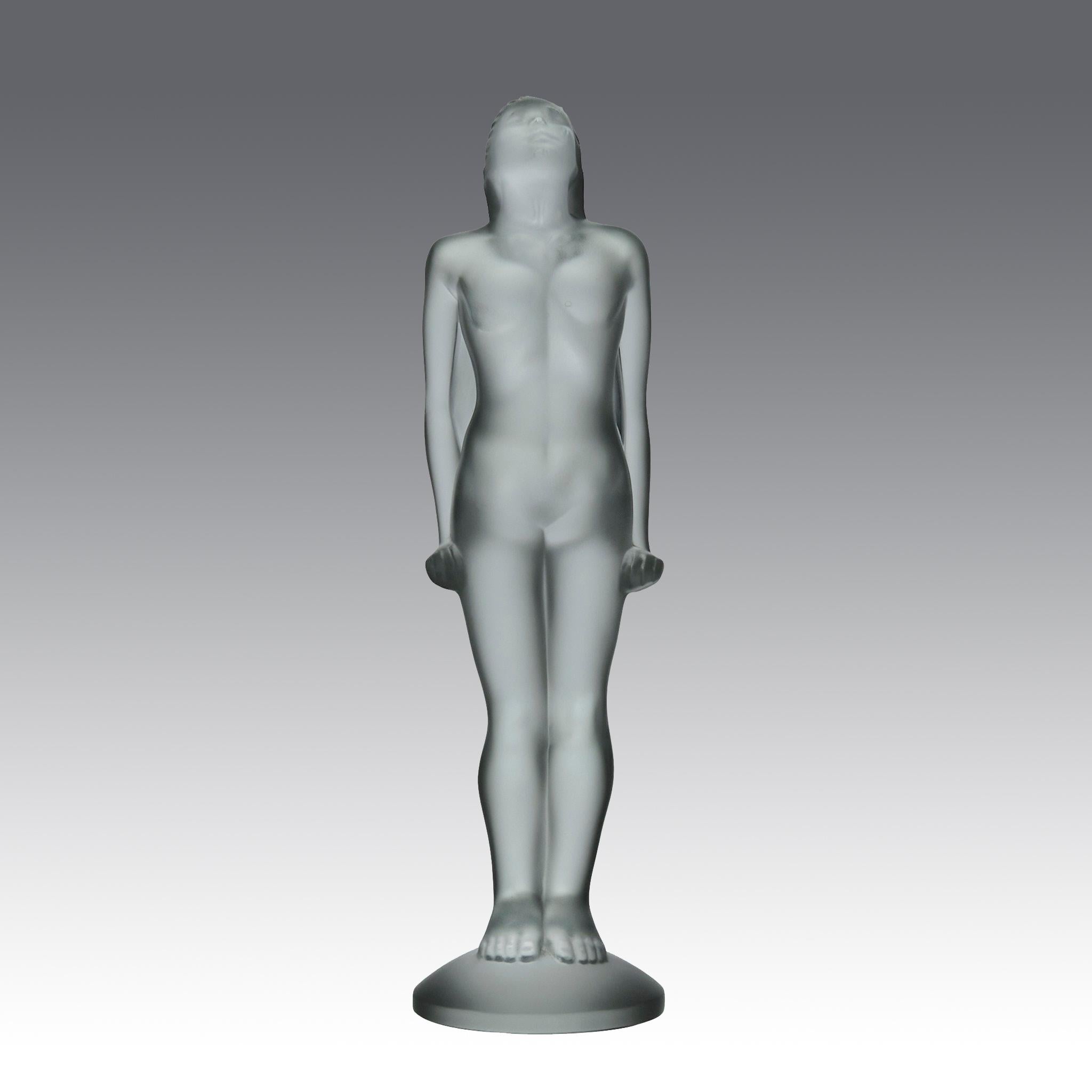 This stunning car mascot by renowned artist Marc Lalique is crafted from frosted glass, featuring a beautiful and elegant nude woman in a stretching pose, signed Lalique France 

ADDITIONAL INFORMATION

Height:                                      