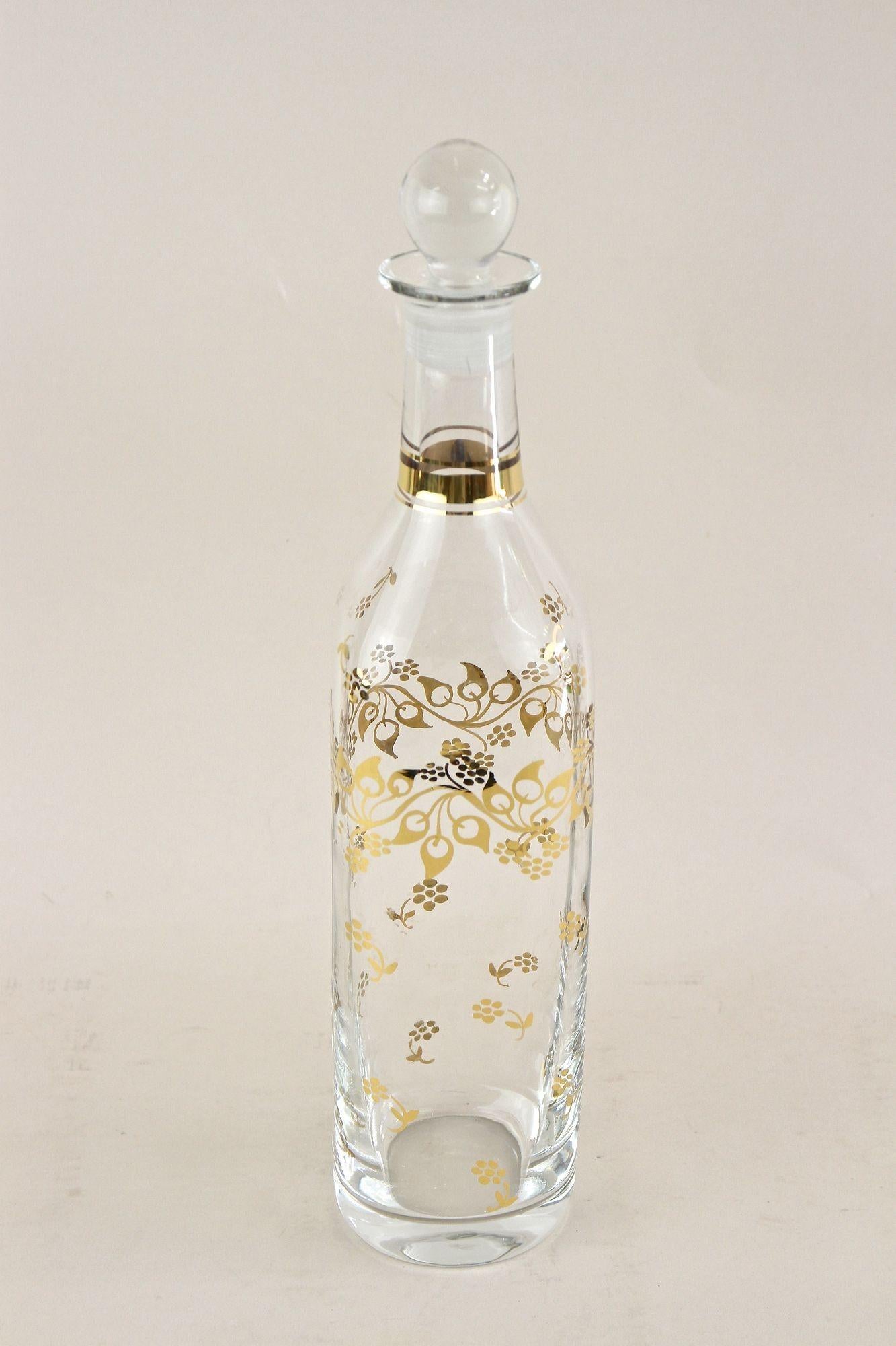 Extraordinary 20th century glass decanter/ liquor bottle from the late Art Nouveau period around 1920 in Austria. An absolute beautiful,  handcrafted bottle made of blown glass. This highly decorative piece of Austrian glass art is adorned by