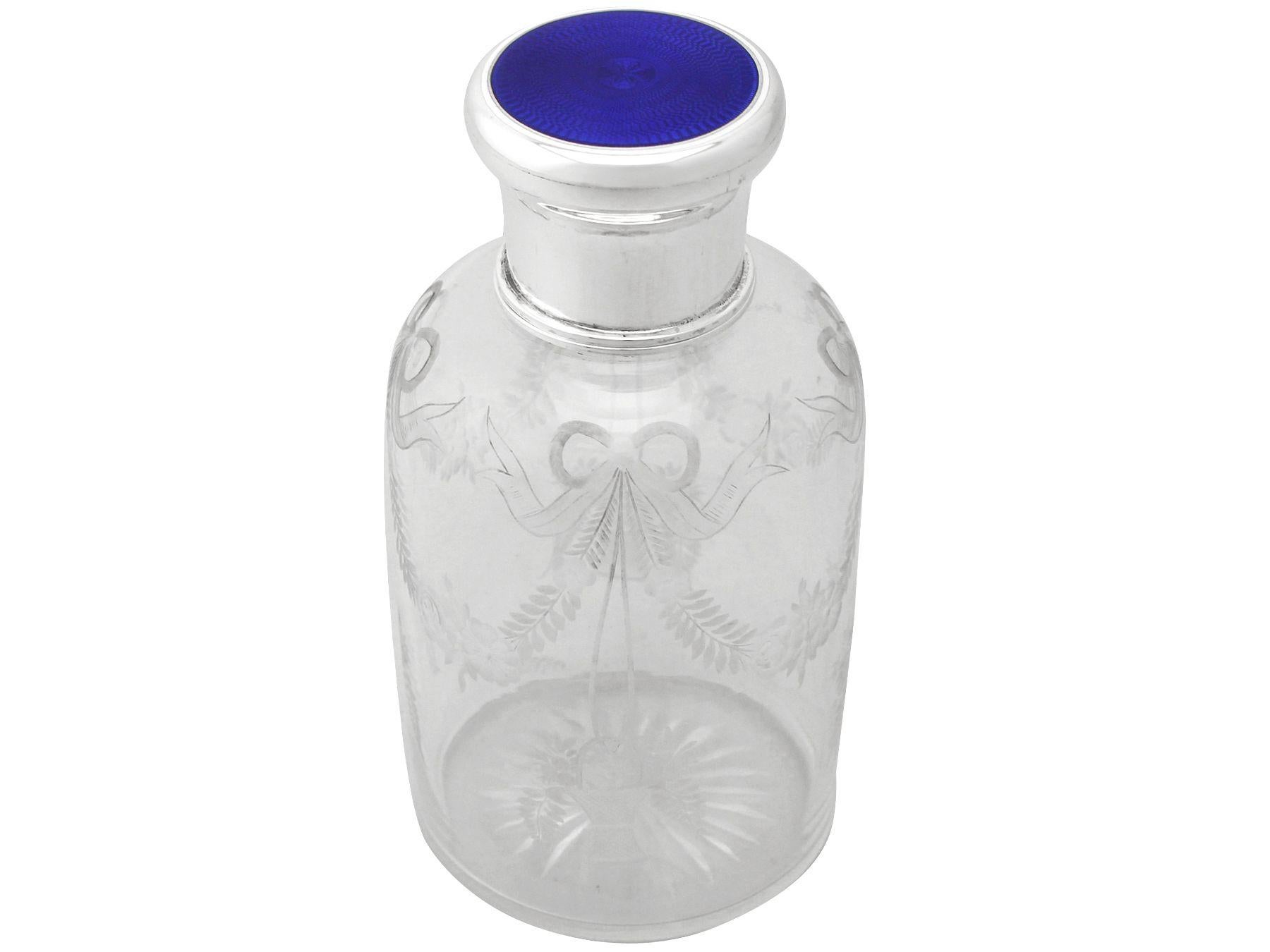 An exceptional, fine and impressive antique George V acid etched glass, English sterling silver and enamel cologne bottle; an addition to our silver mounted glass collection.

This exceptional antique George V glass cologne bottle has a