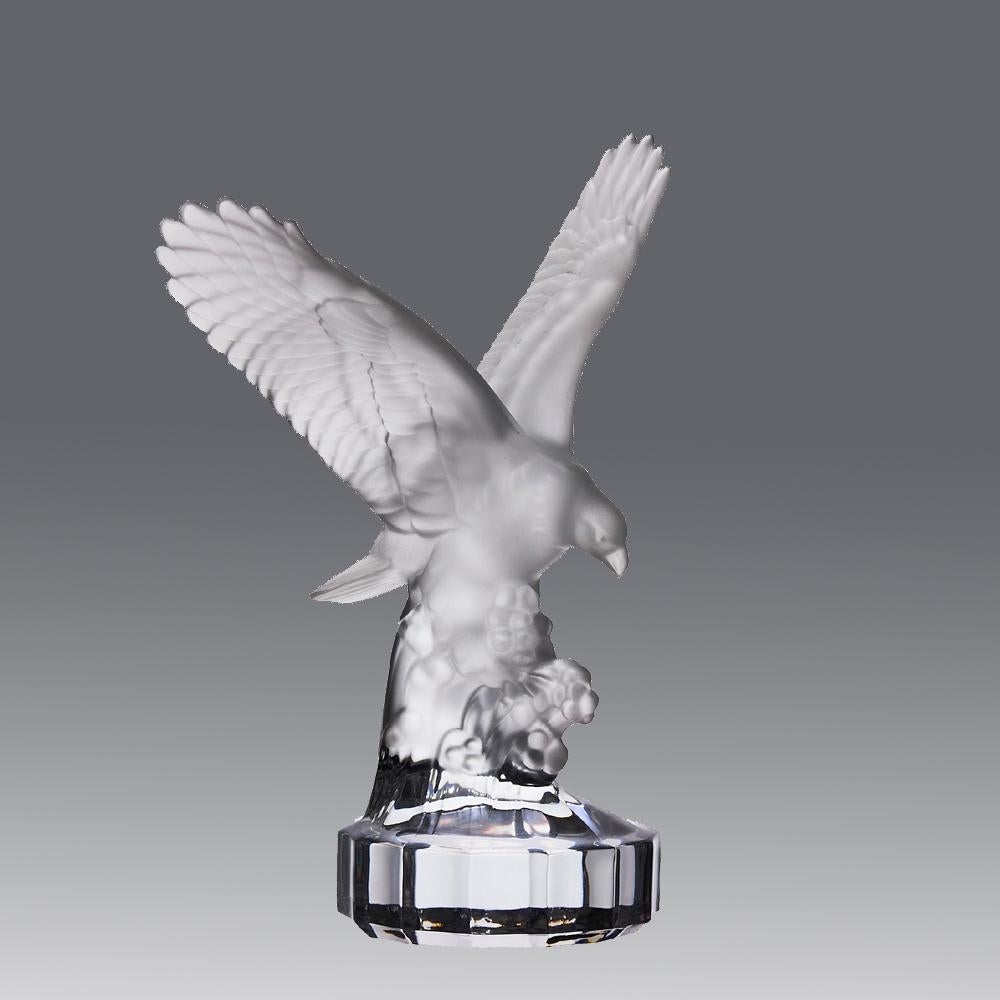 A striking mid 20th Century clear and frosted glass study of an eagle perched on a rocky landscpae with its wings outspread with fine detail, signed Goebel

ADDITIONAL INFORMATION
Height:                                     19 cm

Width:            