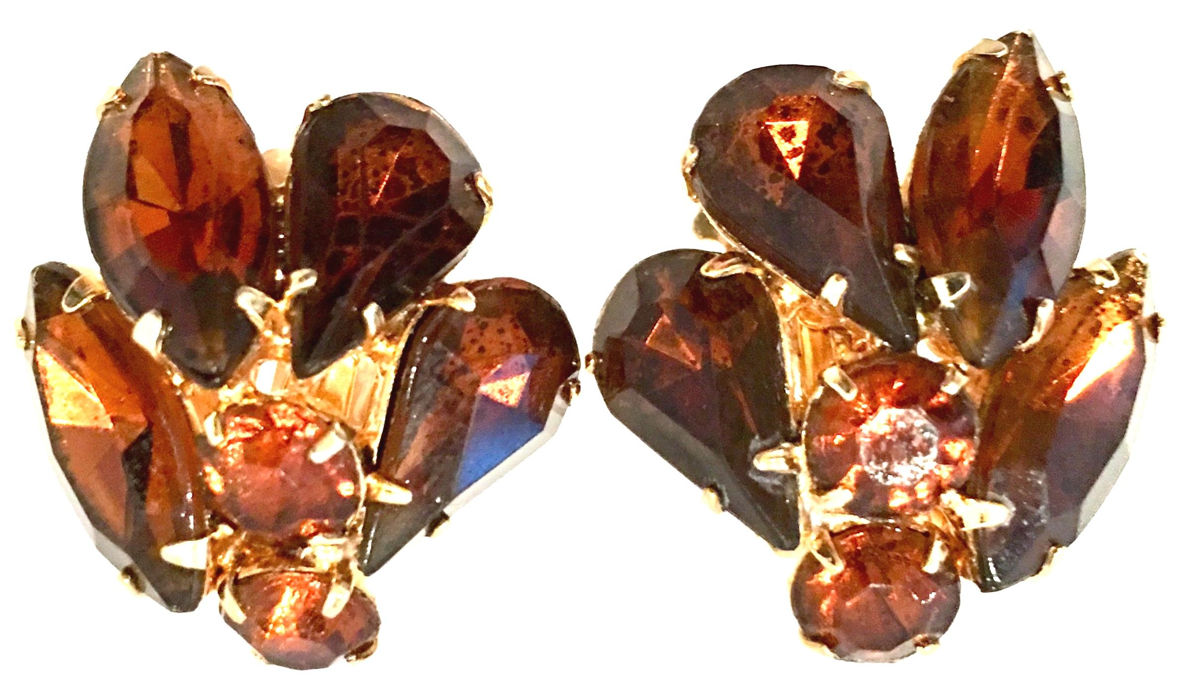 20th Century Gold Plate & Austrian Crystal Abstract Floral Clip Style Earrings. These clip style, right and left designed earrings feature brilliant amber cut and faceted fancy prong set stones.