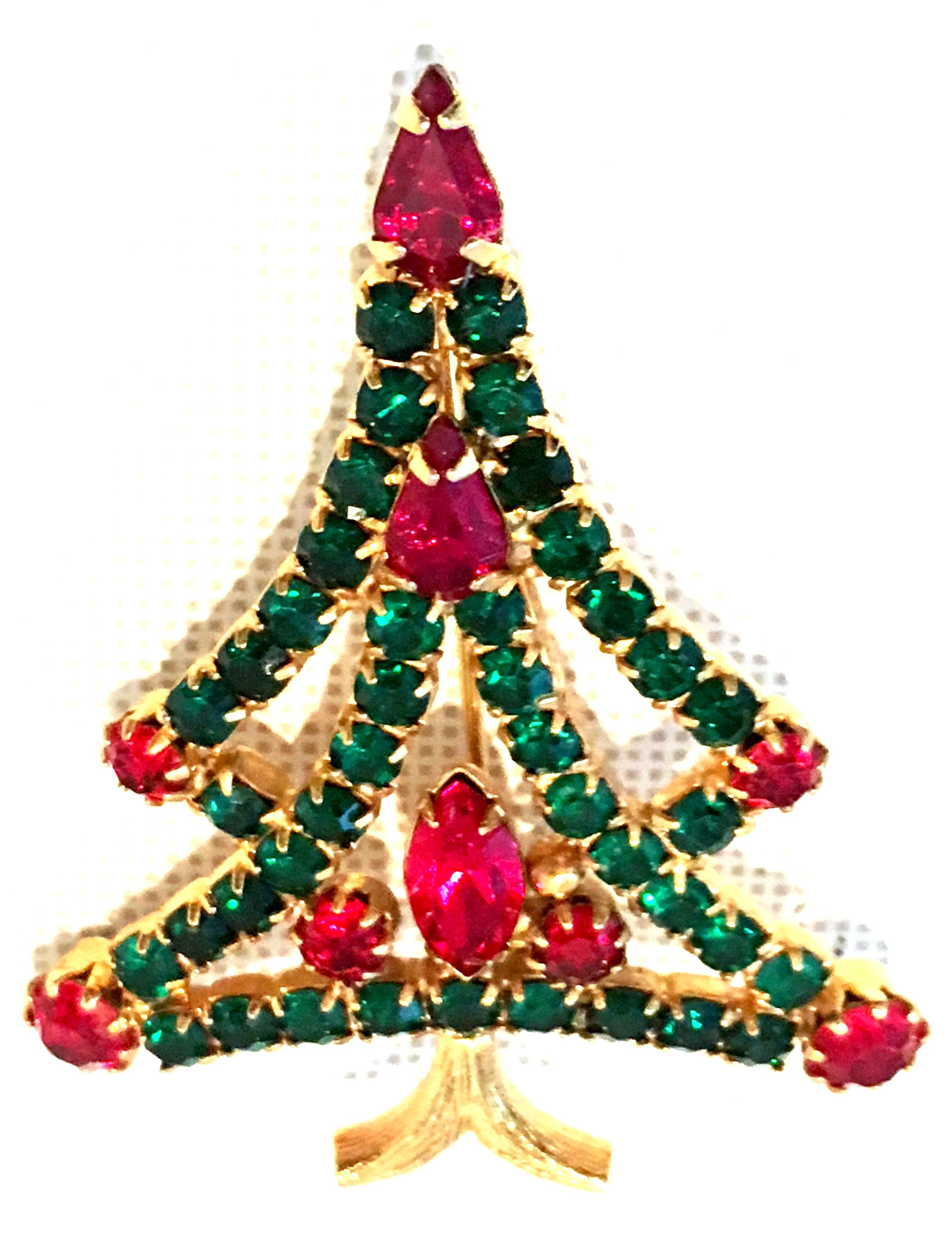20th Century Gold & Austrian Crystal Christmas Tree Brooch. This gold plate classic and timeless Christmas Tree brooch features brilliant cut and faceted fancy prong set emerald green and ruby red Austrian crystal stones.