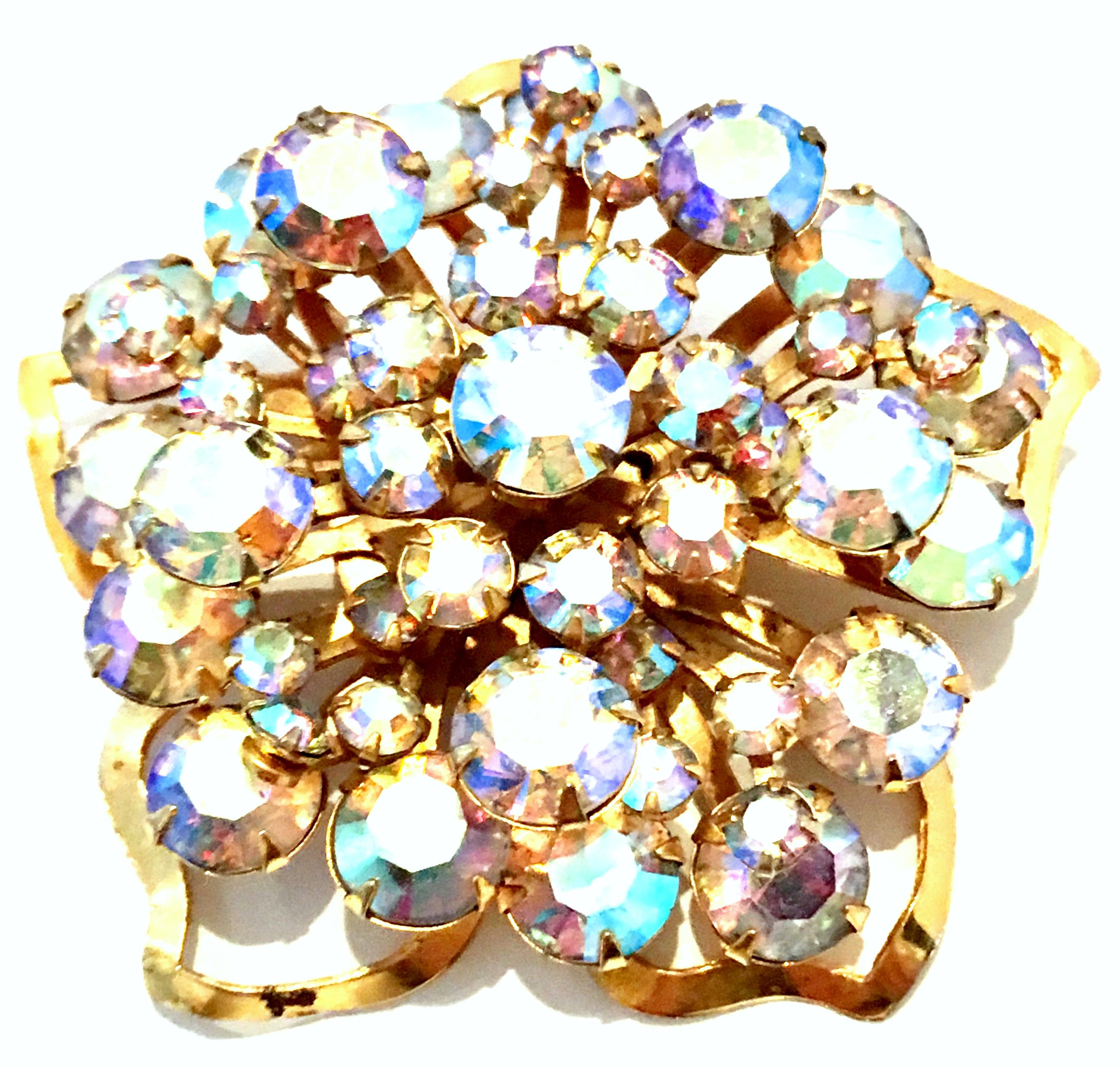 20th Century Gold Plate & Austrian Crystal Dimensional Floral Brooch. This finely crafted gold plate and brilliant cut and faceted Aurora Borealis Austrian Crystal fancy prong set brooch features a multi dimensional abstract floral form. 
