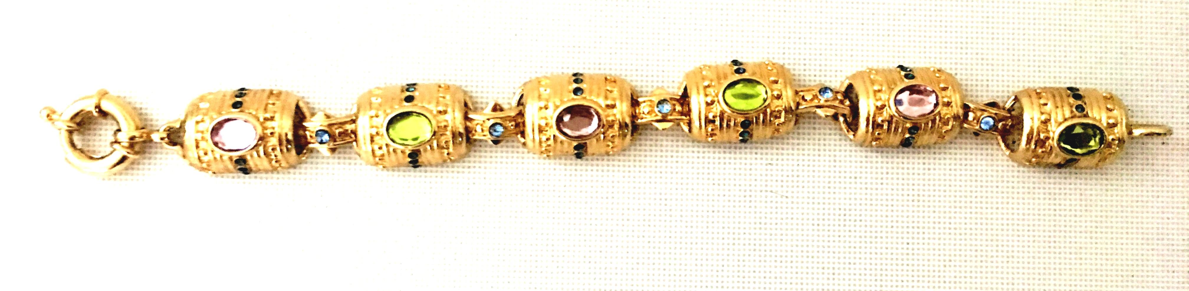 1980'S Gold Plate & Austrian Crystal Etruscan Style Six Link Bracelet. Features six curved gold plate links with cabochon set multi color Austrian crystal. Each link is approximately, 1