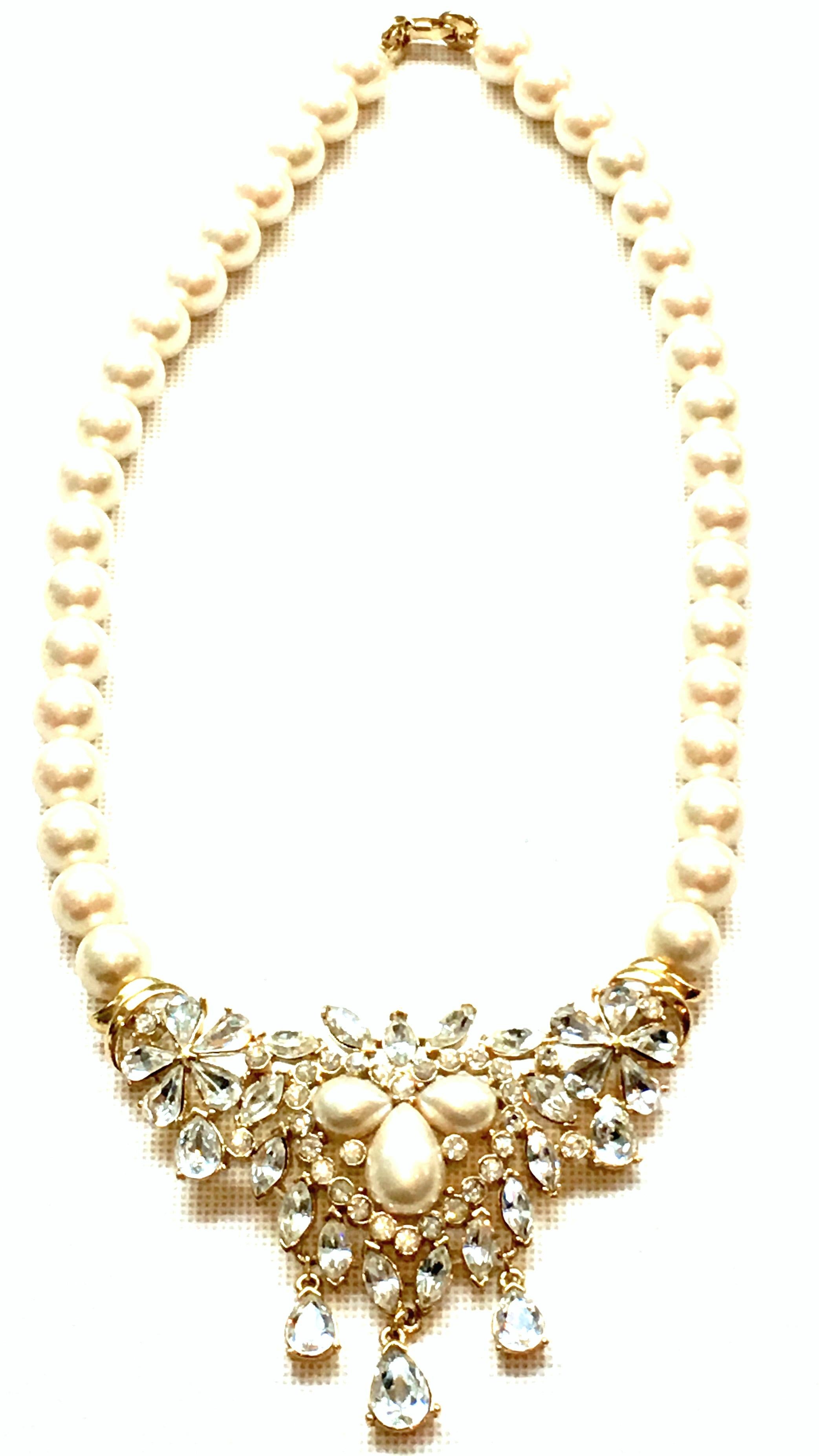 20th Century Gold Plate Austrian Crystal & Faux Pearl Bead Necklace By Kunio Matsumoto For Trifari. Finely crafted of gold plate, off white faux pearl beads, brilliant cut and faceted colorless fancy prong set Austrian Crystal stones this classic,