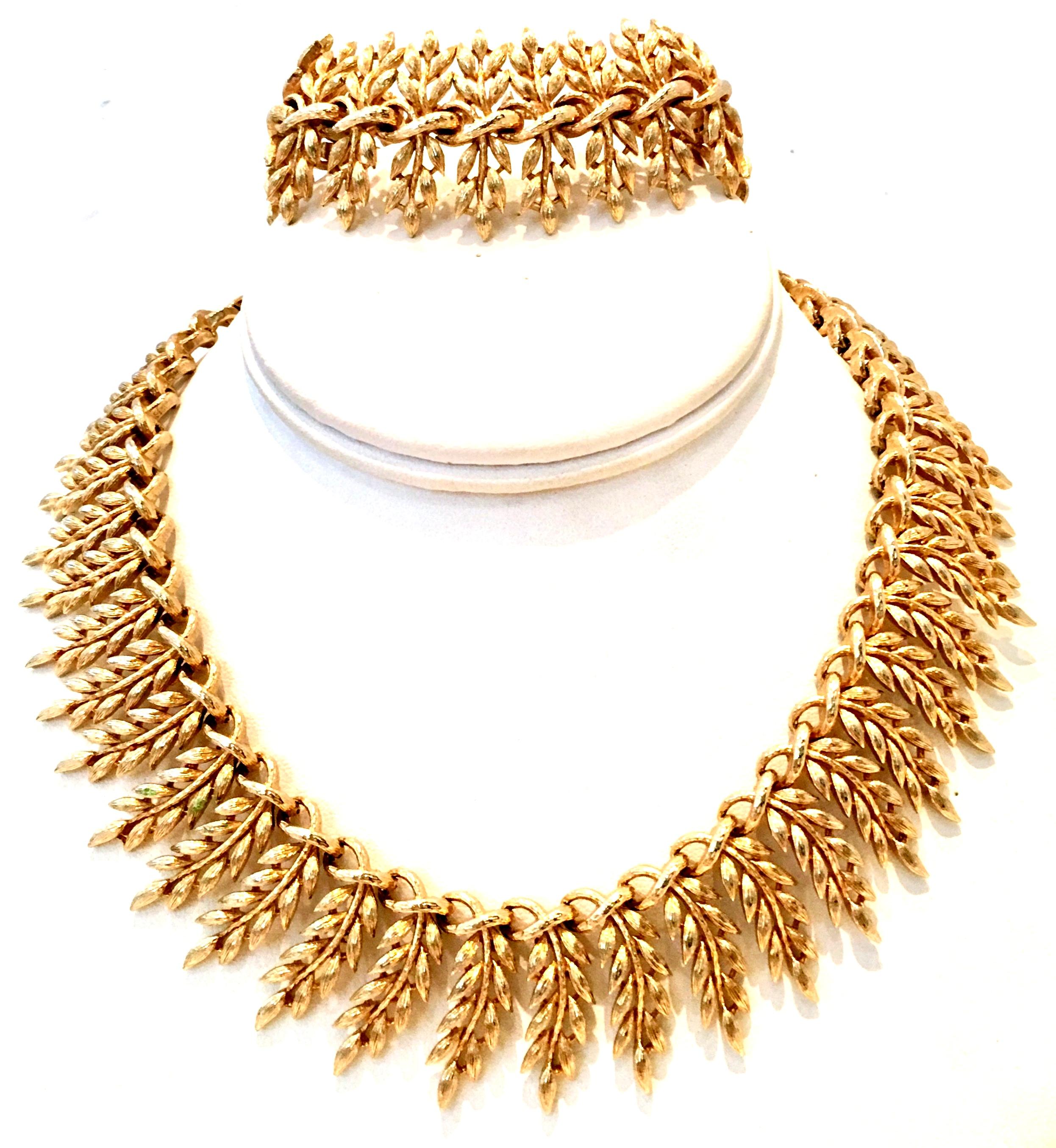 20th Century Gold Plate Choker Style Necklace & Link Bracelet By, Lisner. This rare and lovely  organic modern rare laurel motif two piece set is finely crafted with a substantial weight, with out being heavy. The laurel links are slightly curved on