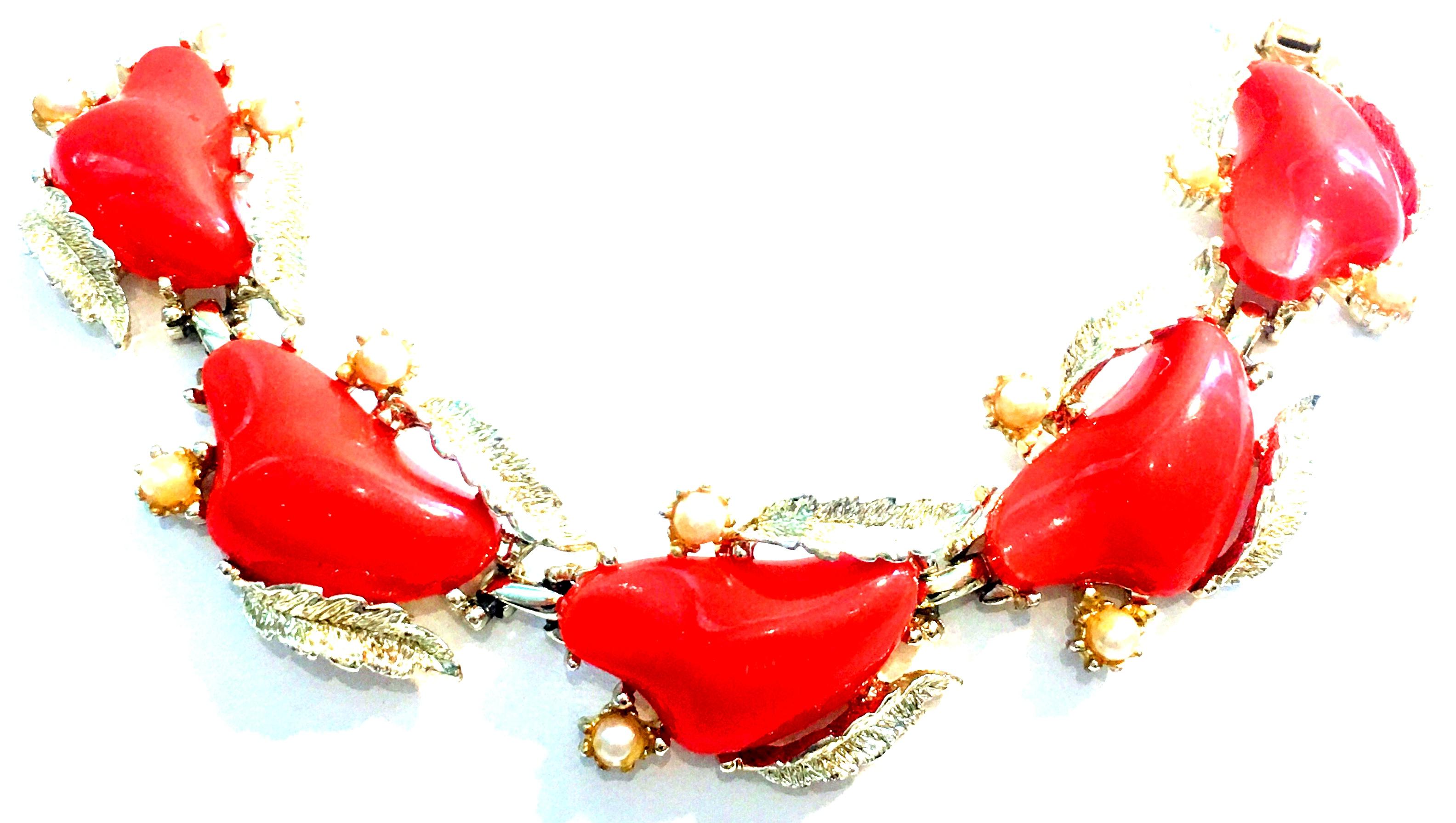 Mid-20th Century Gold Plate, Faux Coral Lucite & Faux Pearl five link Bracelet & Pair Of Earrings By, Coro Set Of Three.
This three piece demi parure 5 link bracelet and pair of earrings by Coro features, gold plate base metal with vivid orange