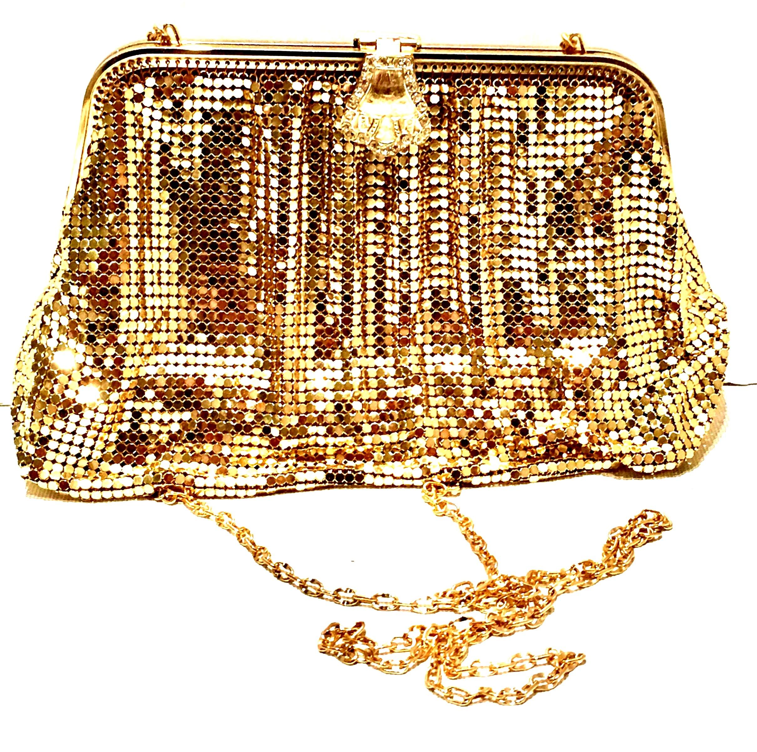20th Century Gold metal mesh & Swarovski Crystal clutch style evening bag by, Whiting & Dab]vis. Features,  gold plate metal mesh and Swarovski crystal adorned snap closure, chain link shoulder strap that can be tucked in when not in use. Fully