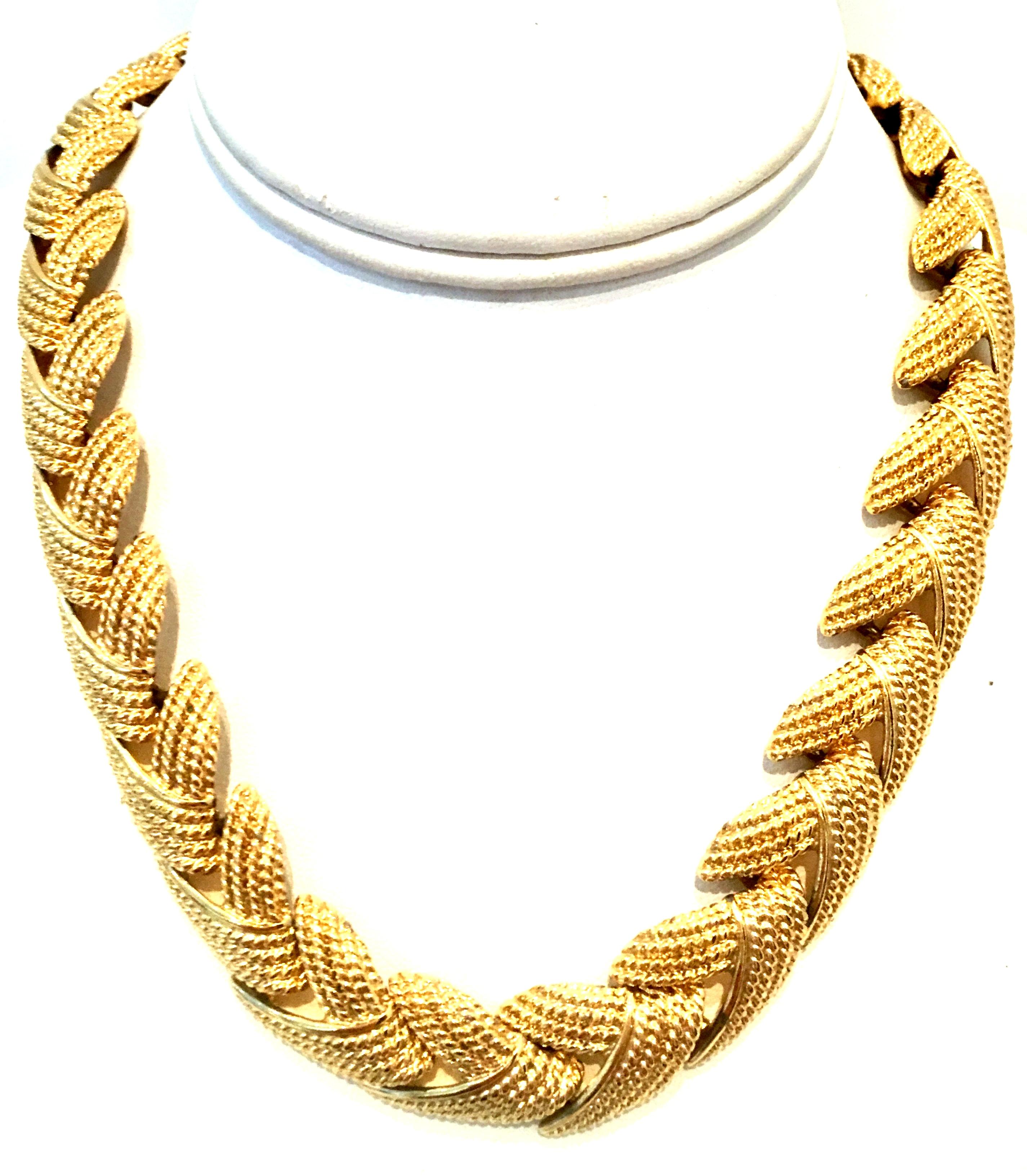 20th Century Gold Plate Choker Style Link Necklace & Bracelet By Napier. This substantially weighted gold plate set of two pieces feature a curved link and textured design. Each piece is signed NAPIER on the fold over box style clasp.
Bracelet