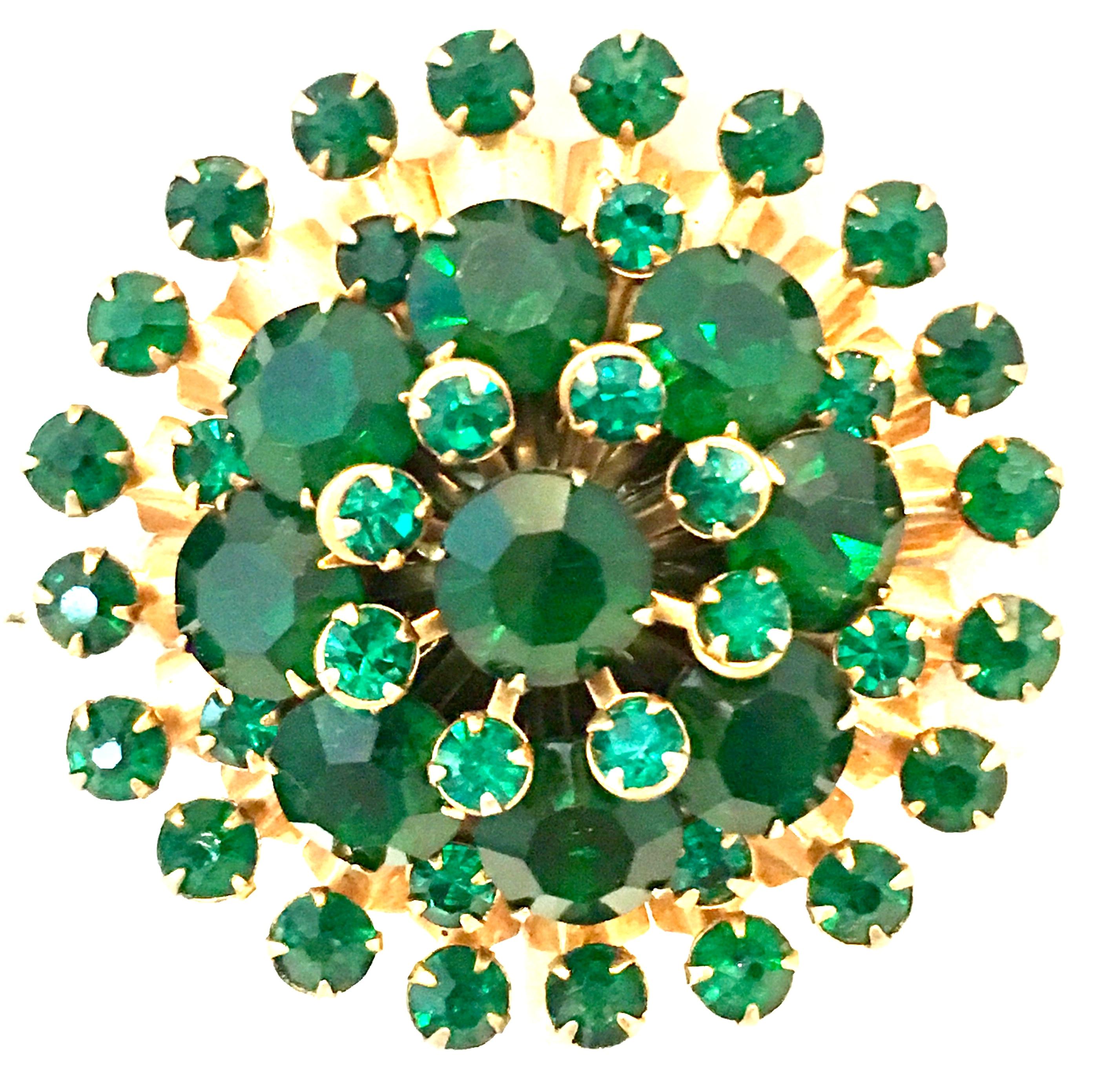20th Century Gold Plate & Emerald Green Austrian Crystal Dimensional Abstract Starburst Brooch. Features gold plate prong set brilliant cut and faceted Austrian crystal stones. The larger stones are approximately, .35