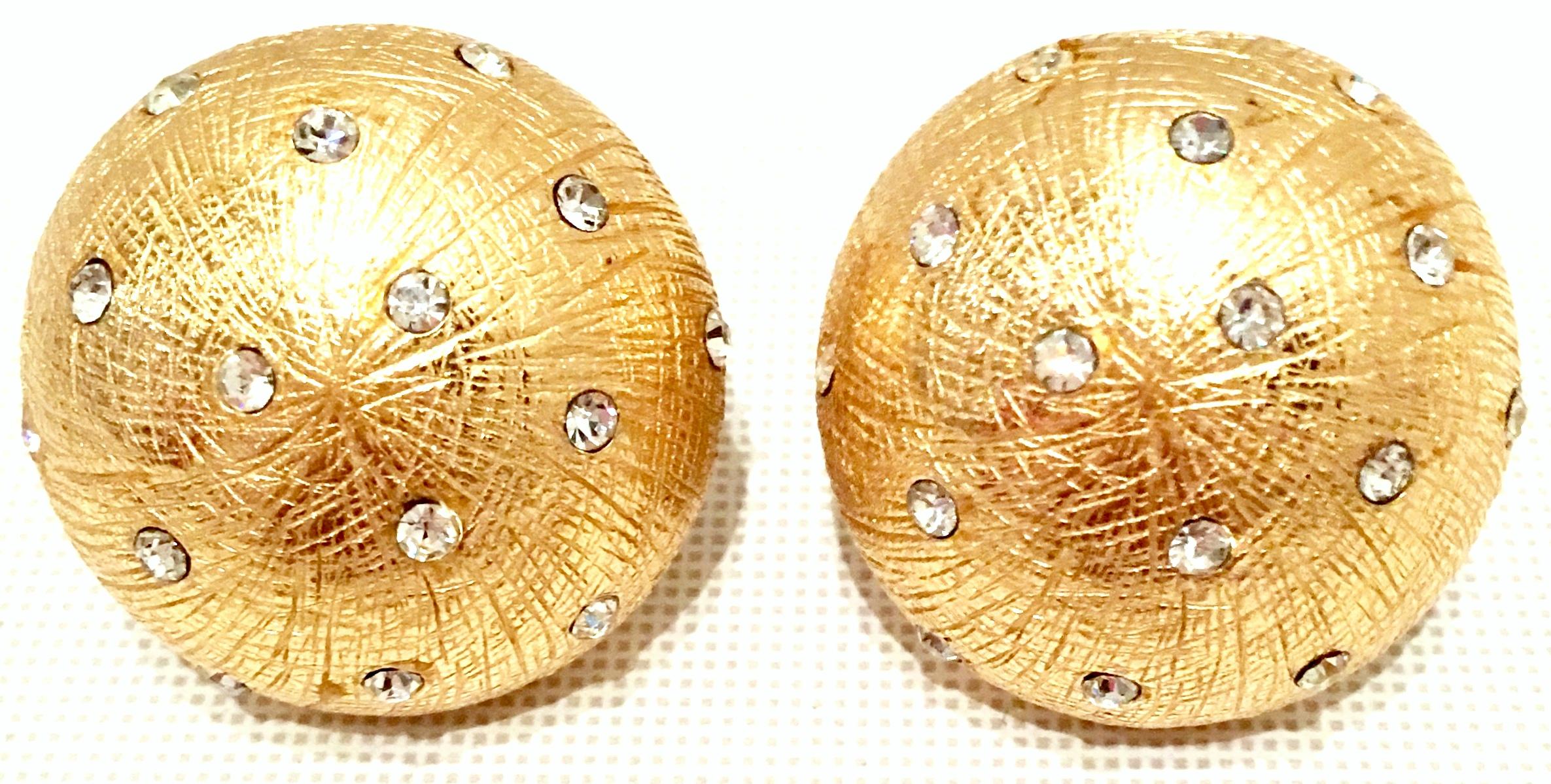 20th Century Brushed Gold Plate & Swarovski Crystal Clip Style Earrings By, Christian Dior. These Dior brushed gold plate with diminutive brilliant crystal clear Swarovski stones are a mushroom cap shape and both signed on the underside, Christian