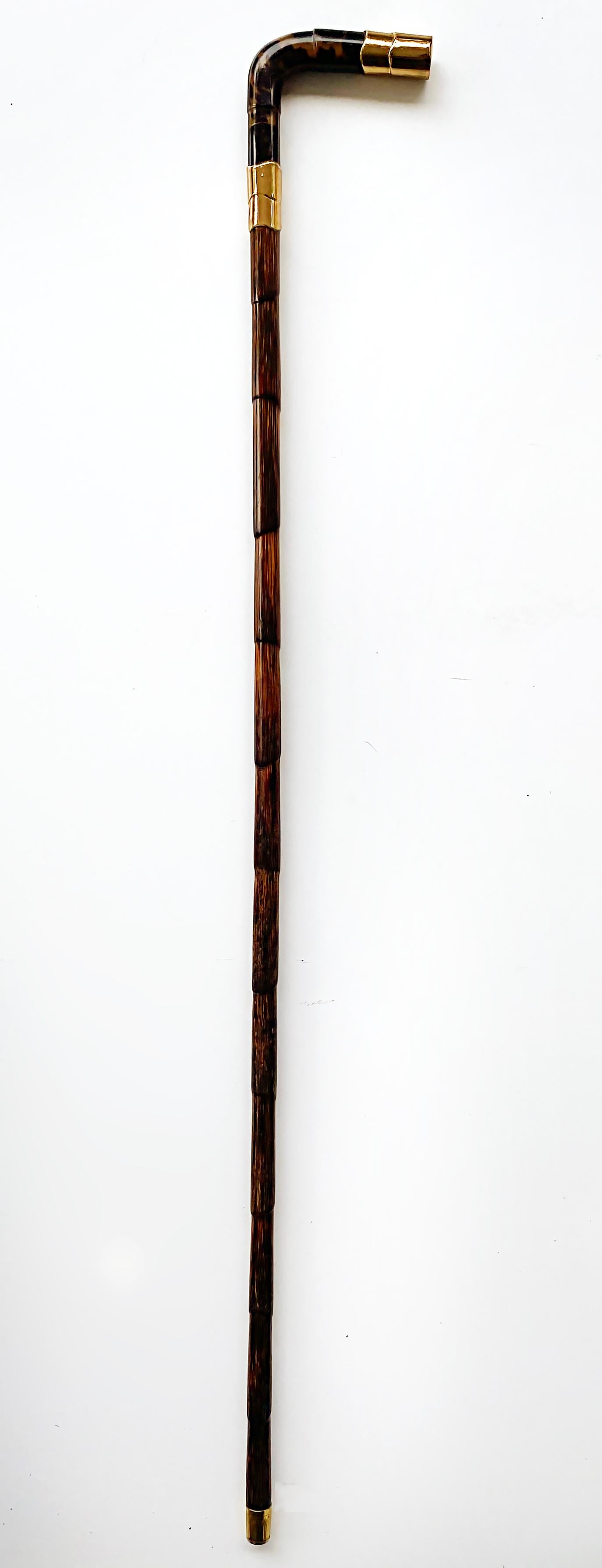 20th Century Gold Plated Rattan Walking Stick, Shell Handle and Bamboo Stick

Offered for sale is an early 20th-century rattan or bamboo walking stick with gold-plated accent trim pieces. The handle end and the stick end have gold-plated fittings