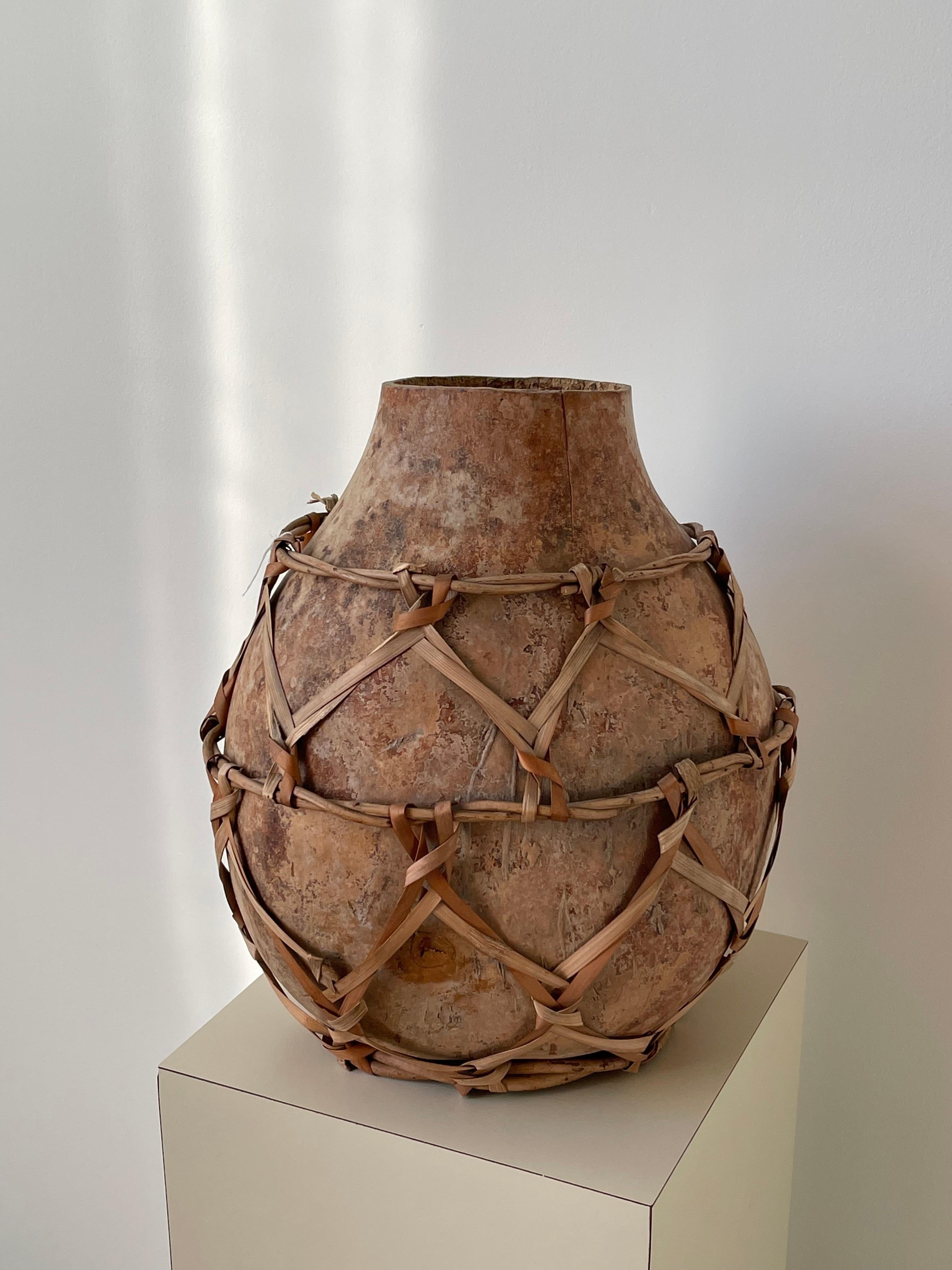 Primitive 20th Century Gourd Vessel with Reed Weaving For Sale
