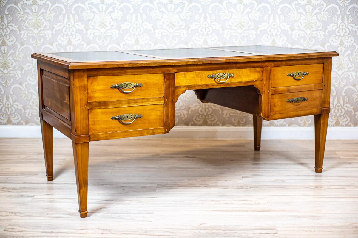 20th Century Grand Ash Prewar Desk with Brass Fillings

We present you a big ash desk circa before 1939.
This piece of furniture is placed on high, angular legs.
There are rows of drawers on both sides, which are divided by a central drawer under