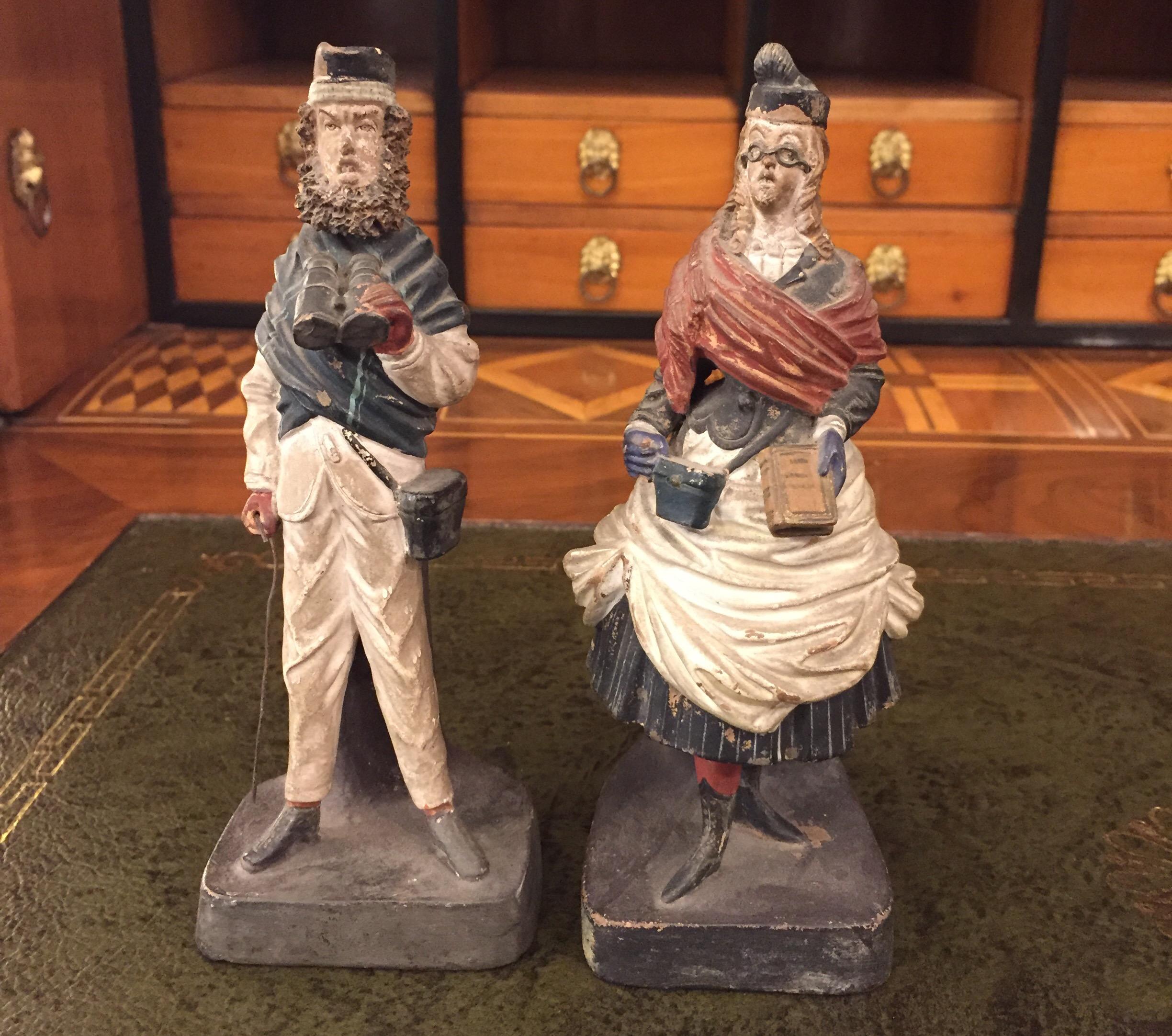 A set of two lovely Grand Tour hand-painted terracotta figurative pen-holders of Neapolitan origin, molded as a male and female foreign tourists caricatures, British characters.
Both polychrome painted earthenware figures are funny Italian desk