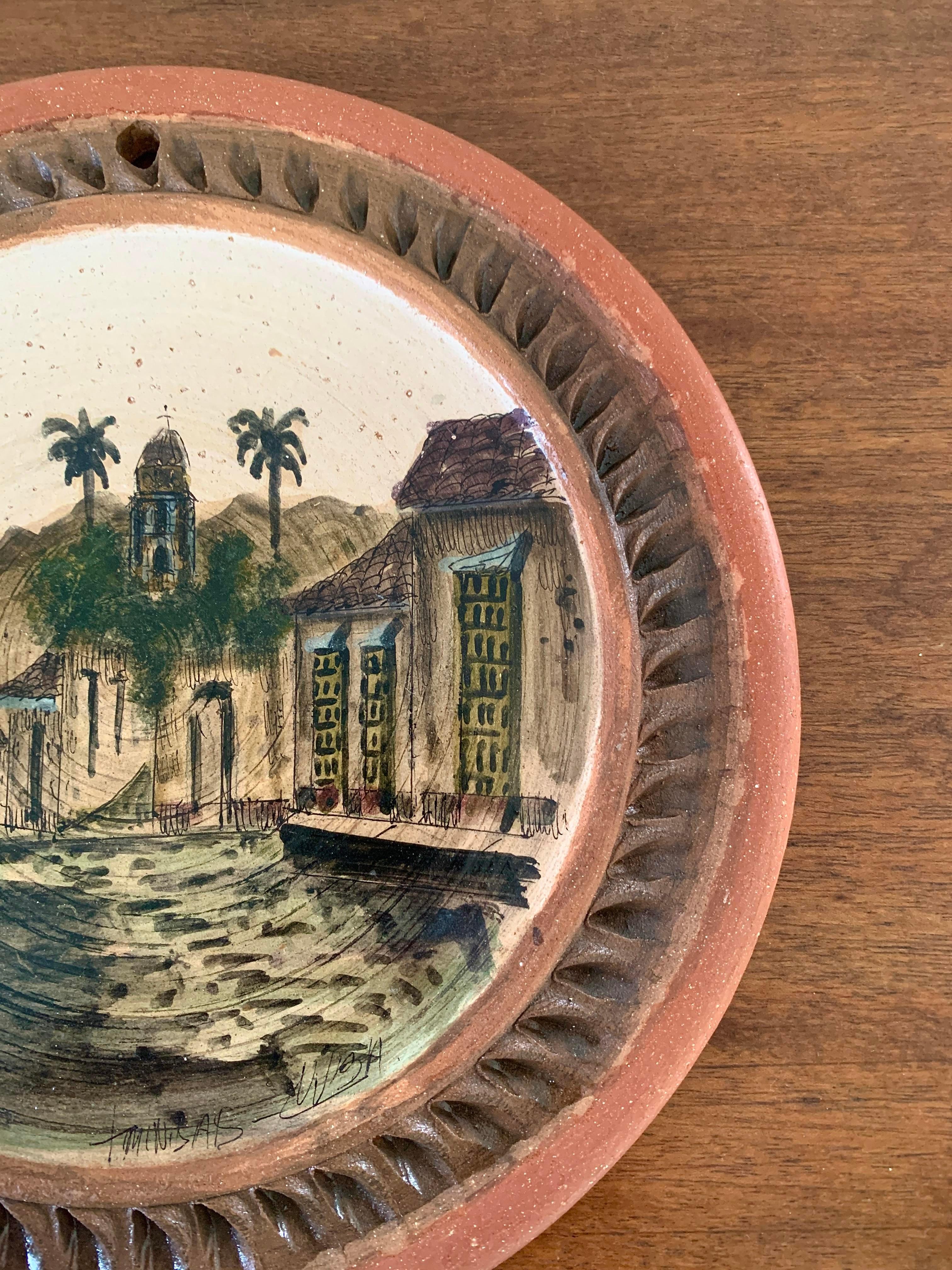 A stunning Grand Tour style hand painted terracotta wall plate featuring a mediterranean scene

Circa mid-20th century

Measures: 9.25