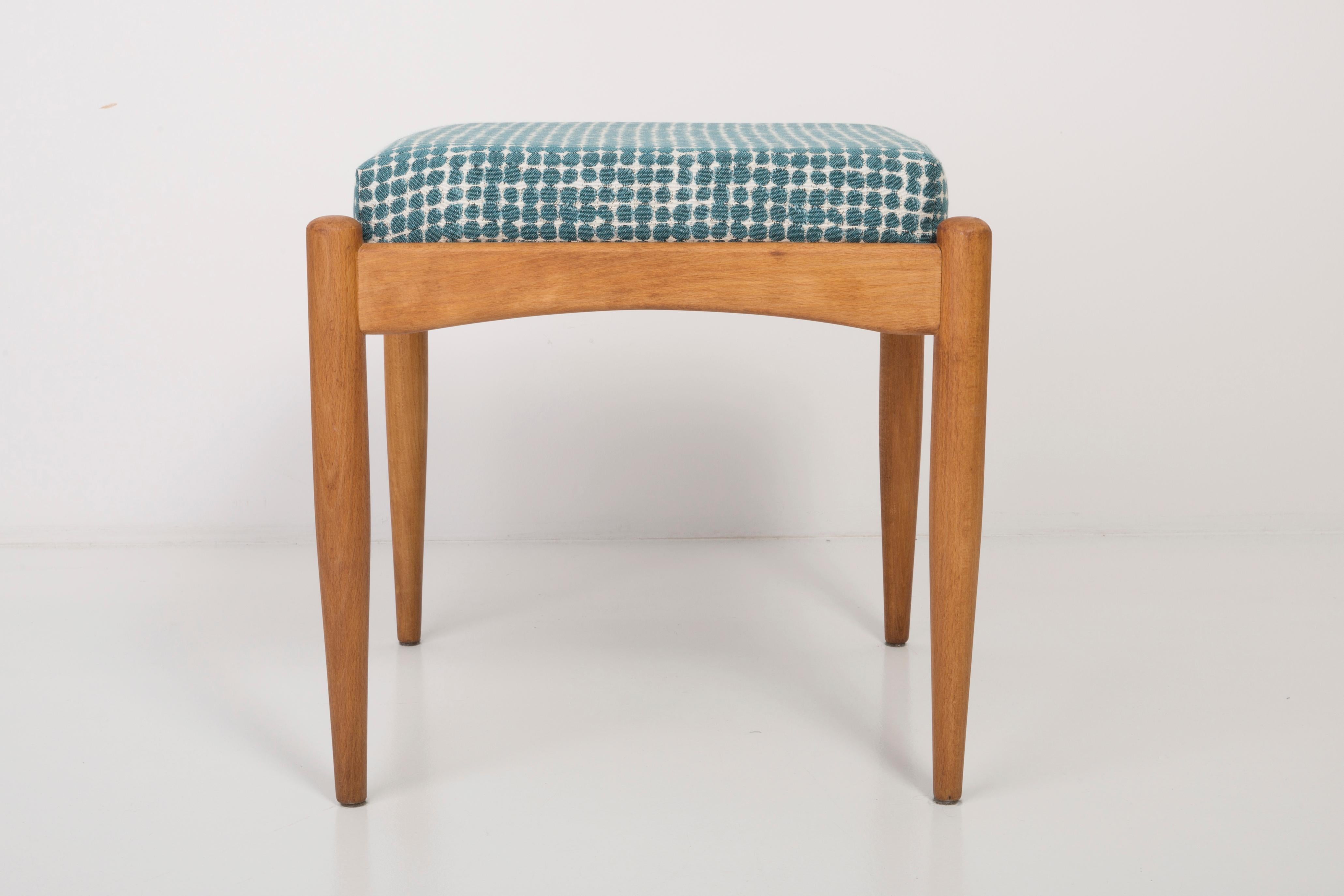 Stool from the turn of the 1960s and 1970s. Beautiful green and white pattern upholstery. The stool consists of an upholstered part, a seat and wooden legs narrowing downwards, characteristic of the 1960s style. We can prepare this stool also in