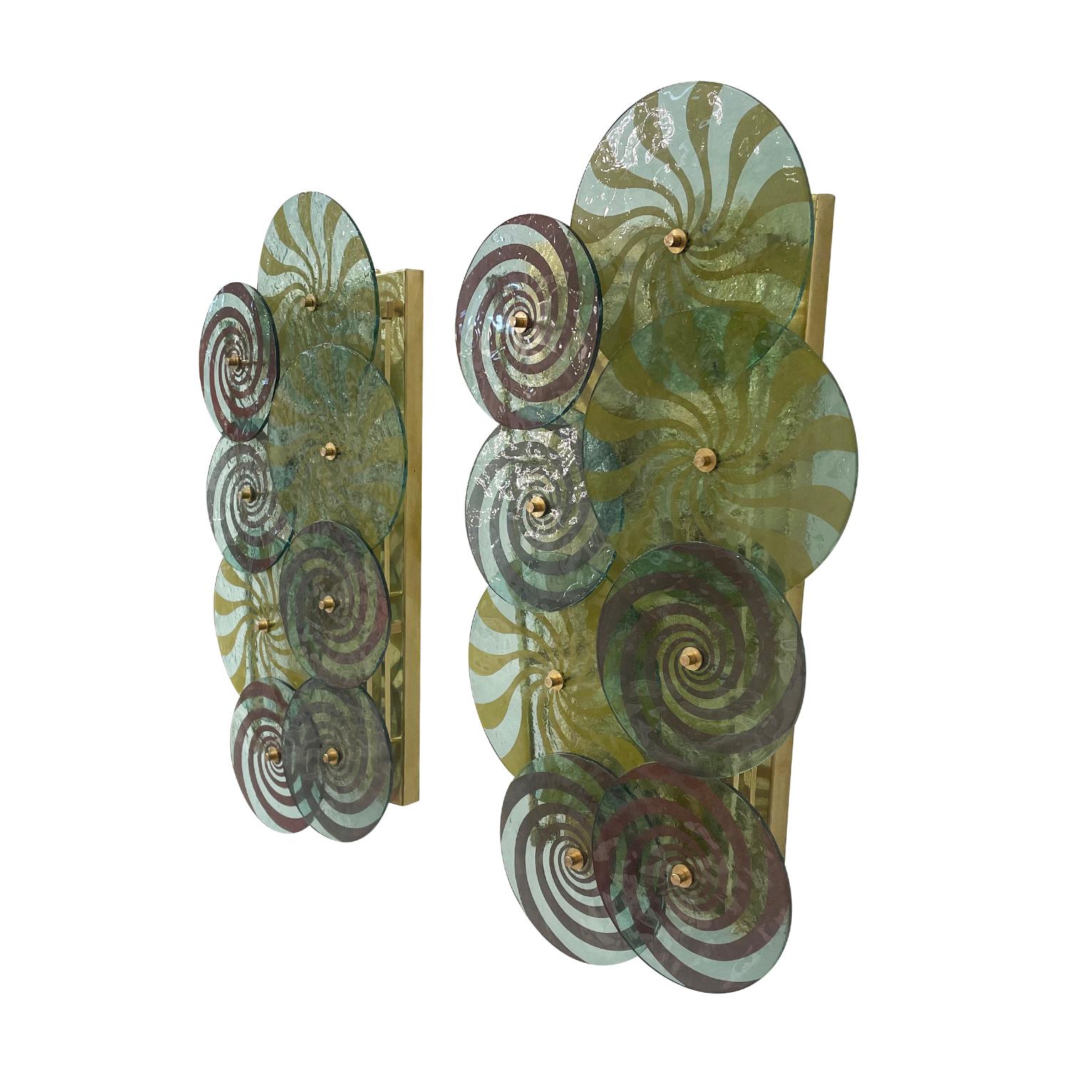 A light-green, vintage Mid-Century modern Italian pair of large wall fixture made of hand blown slightly smoked Murano glass, in good condition. Each of appliques, sconces are composed with eight colored discs which are overlapping, featuring a four