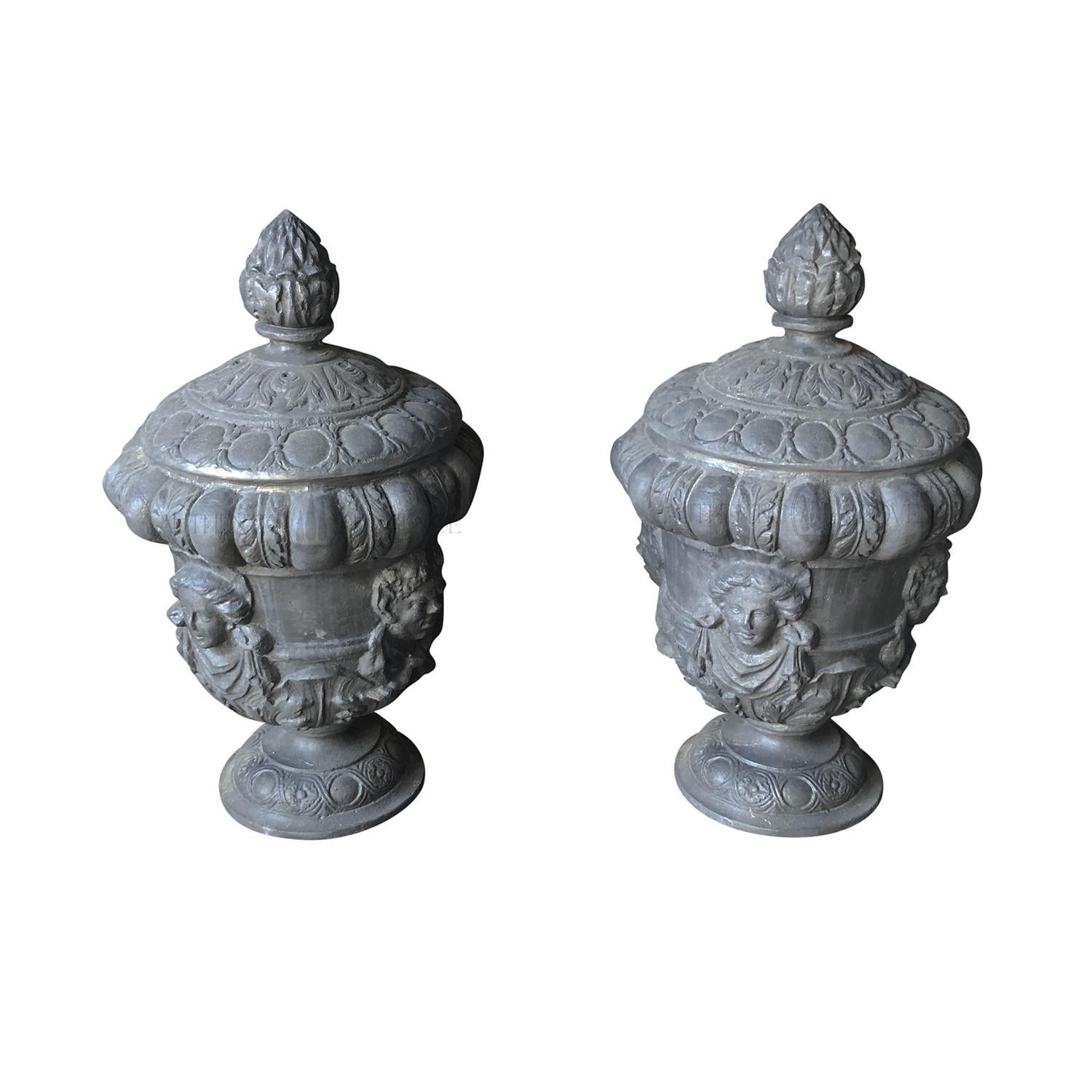 A finely worked pair of 20th Century Queen Anne Finials or garden urns in lead on circular socles, in good condition. From an early 18th Century lead casting, similar can be seen at Hyde Park Corner. During the late 17th and 18th Century, lead urns