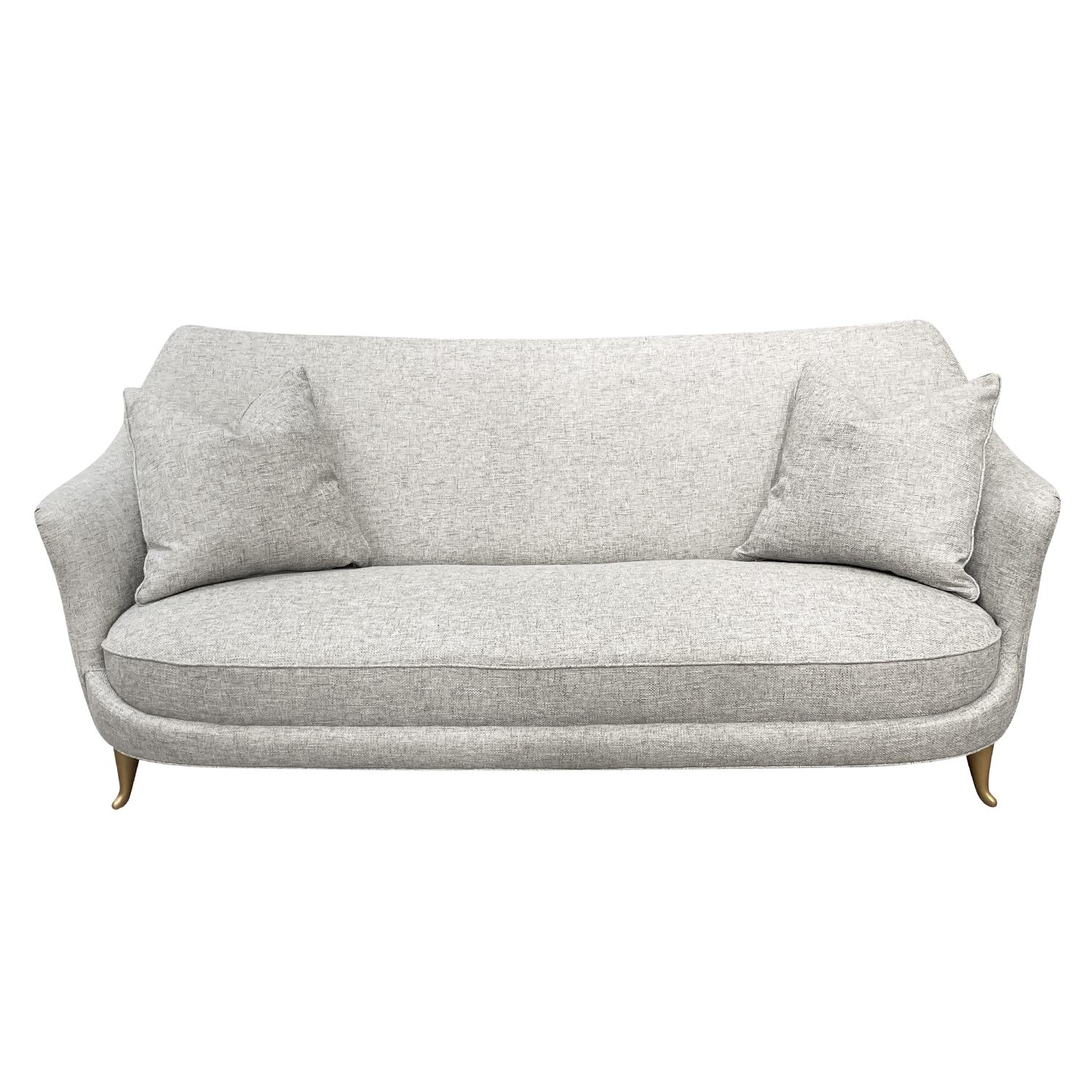 A vintage Mid-Century Modern Italian two seater sofa or settee with two pillows, designed and produced by ISA Bergamo, in good condition. The seat backrest of small divano, canapé has a floating back with gently, slim outstretched arms, supported by