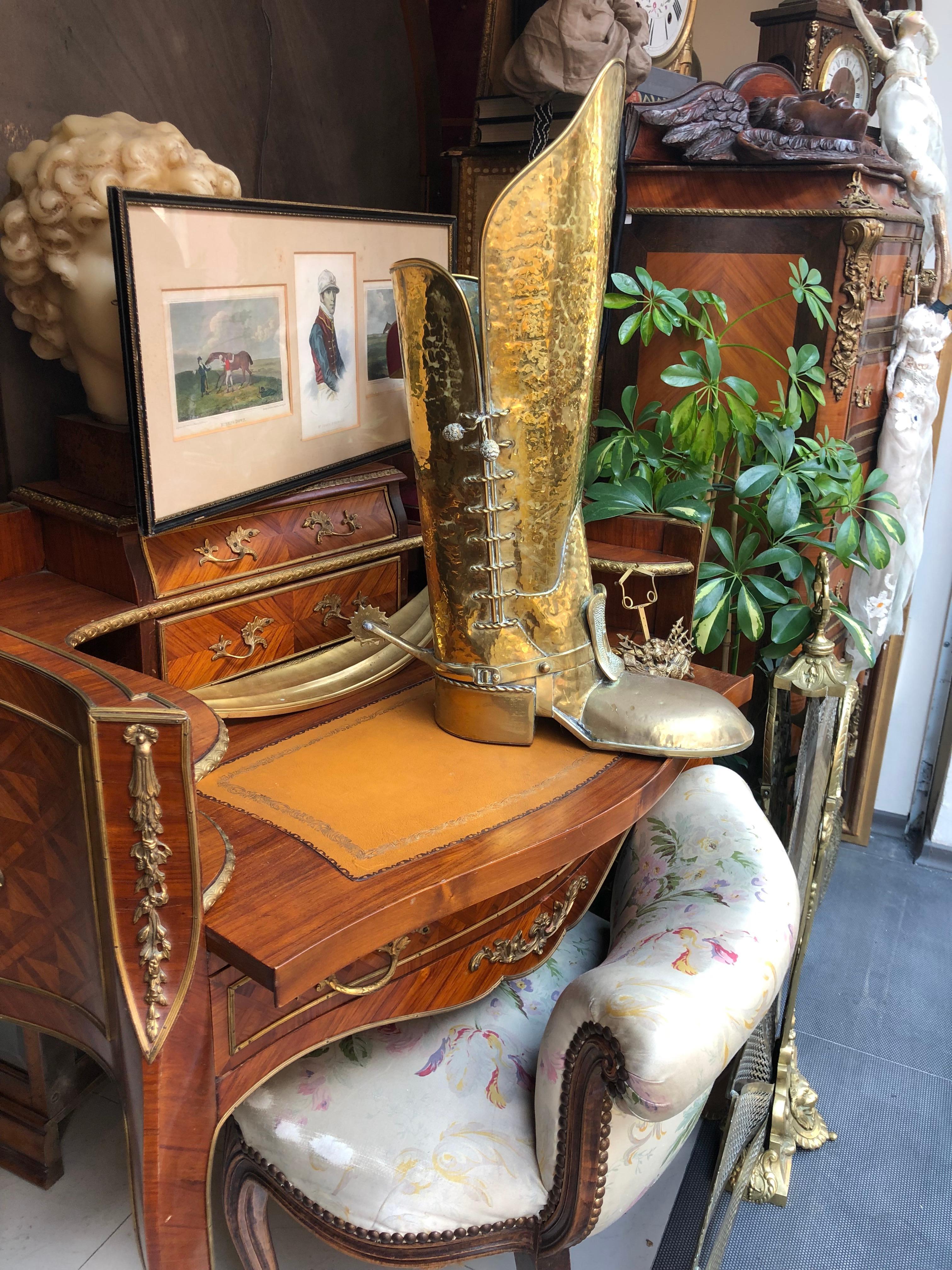 Very realistic hand-hammered solid brass boot umbrella holder with wonderful details.
France, circa 1920.
   