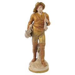 Escultura masculina decorativa de porcelana pintada a mano/dorada del siglo XX