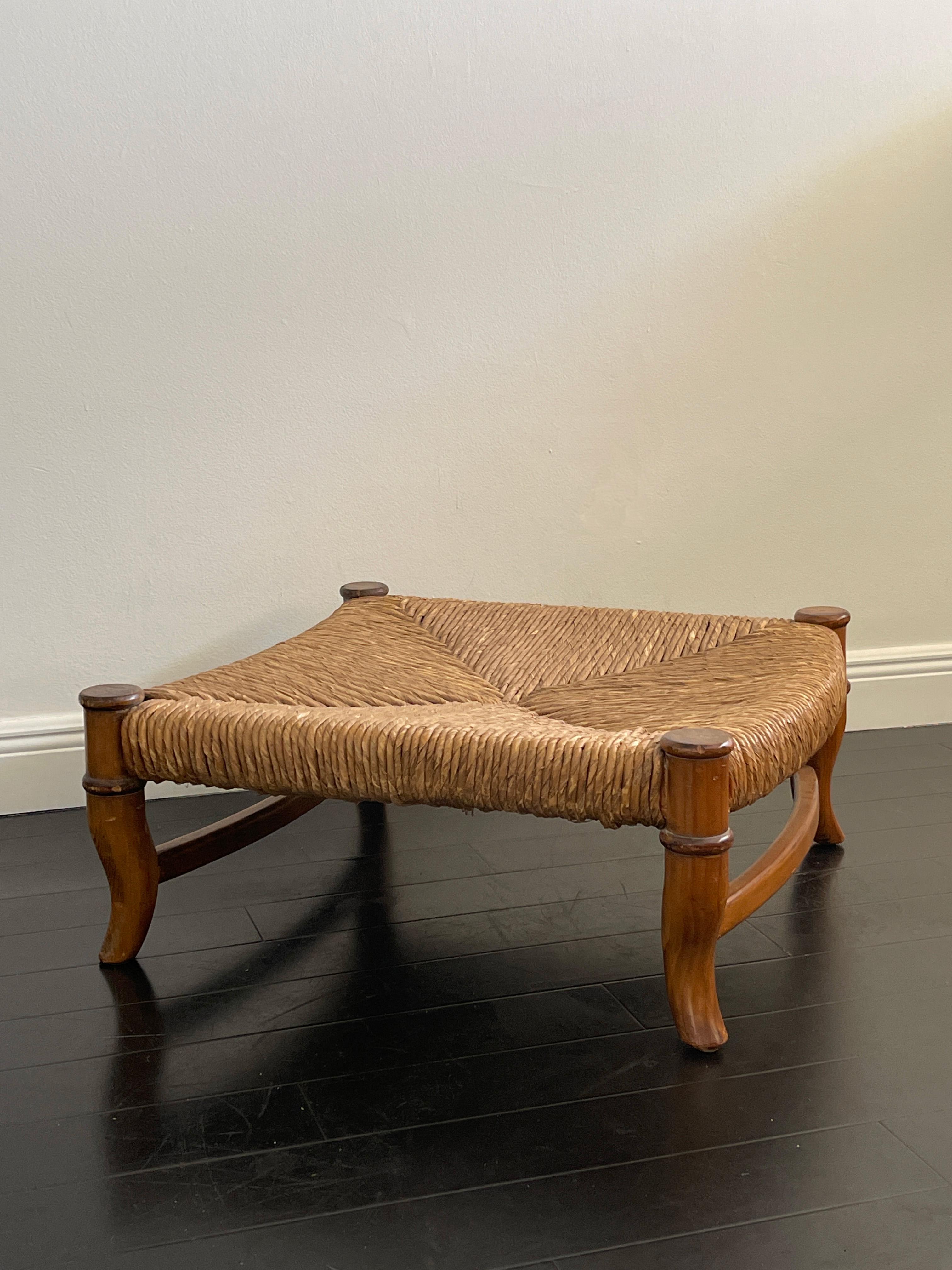 20th Century hand woven wicker and wood ottoman with bent wood legs. Beautiful design and organic colors and feel. Perfect for an ottoman or a coffee table.