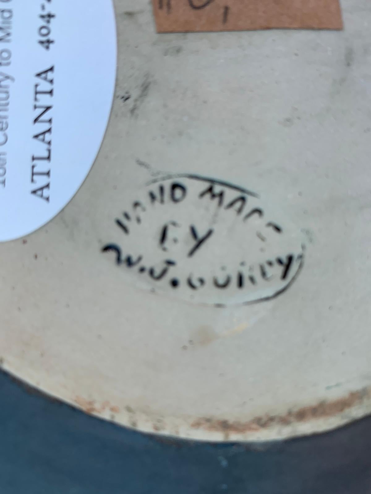 20th century handmade round pottery plate by W.J. Gordy, marked with original label and potter's mark
Made in Georgia.