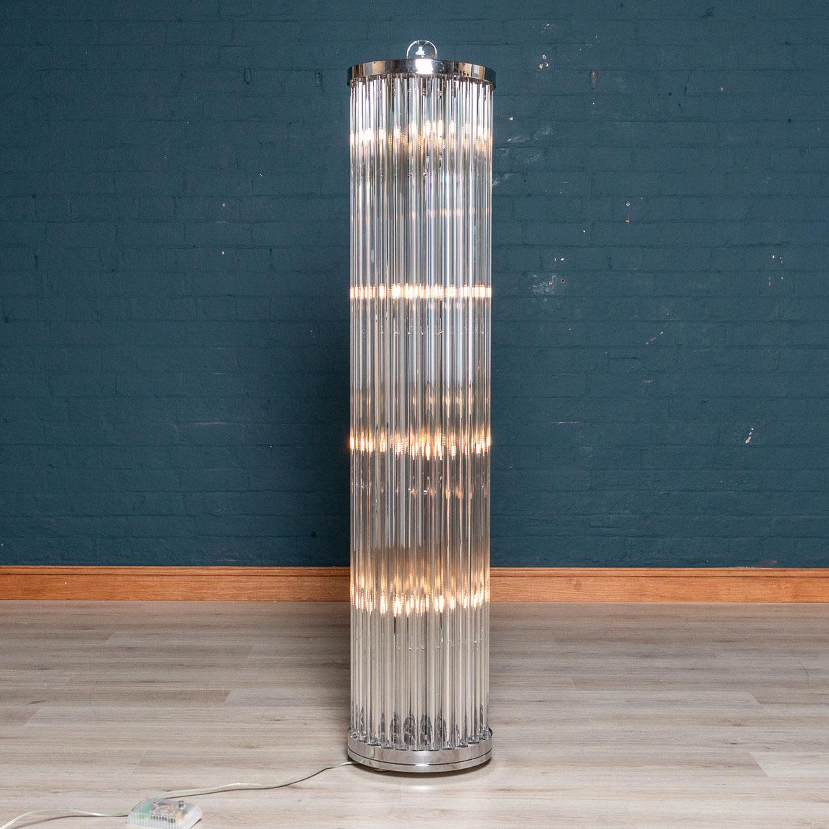 A wonderful 1950s inspired floor lamp in Murano glass. Composed of 25 triangular prisms mounted on a chromed structure with a circular base, the finial made from a glass sphere also in Murano glass. Inside it has eight LED light points on a dimmer