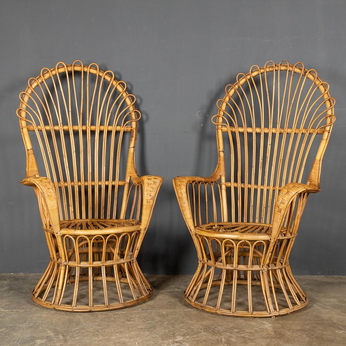 A lovely and very unusual pair of high backed chairs realised entirely out of bamboo, great addition to any room or conservatory.

CONDITION
In Great Condition - no damage.

SIZE
Height: 131cm
Width: 80cm
Depth: 51cm.