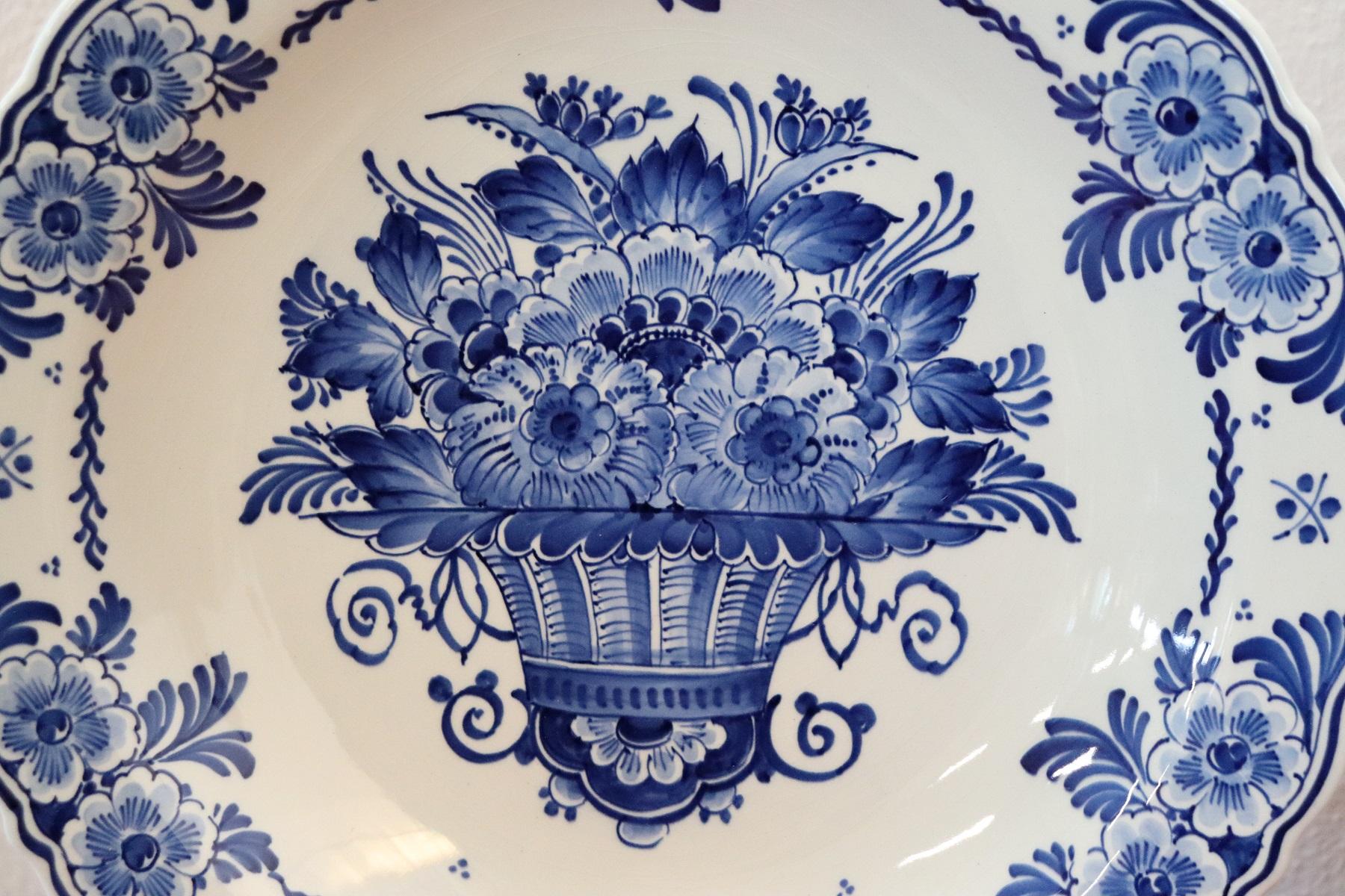 Beautiful set of two platters in ceramic by Delft. Refined floral decoration in shades of blue. This is a collectible ceramic.
  
