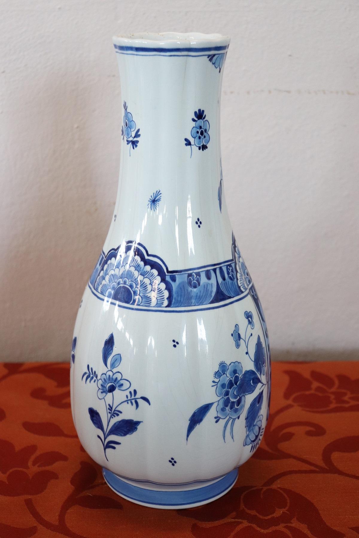 Beautiful vase in ceramic decorated by Delft in shades of blue. Classical taste decoration with cherubs. This is a collectible ceramic.
Biographical note.
  