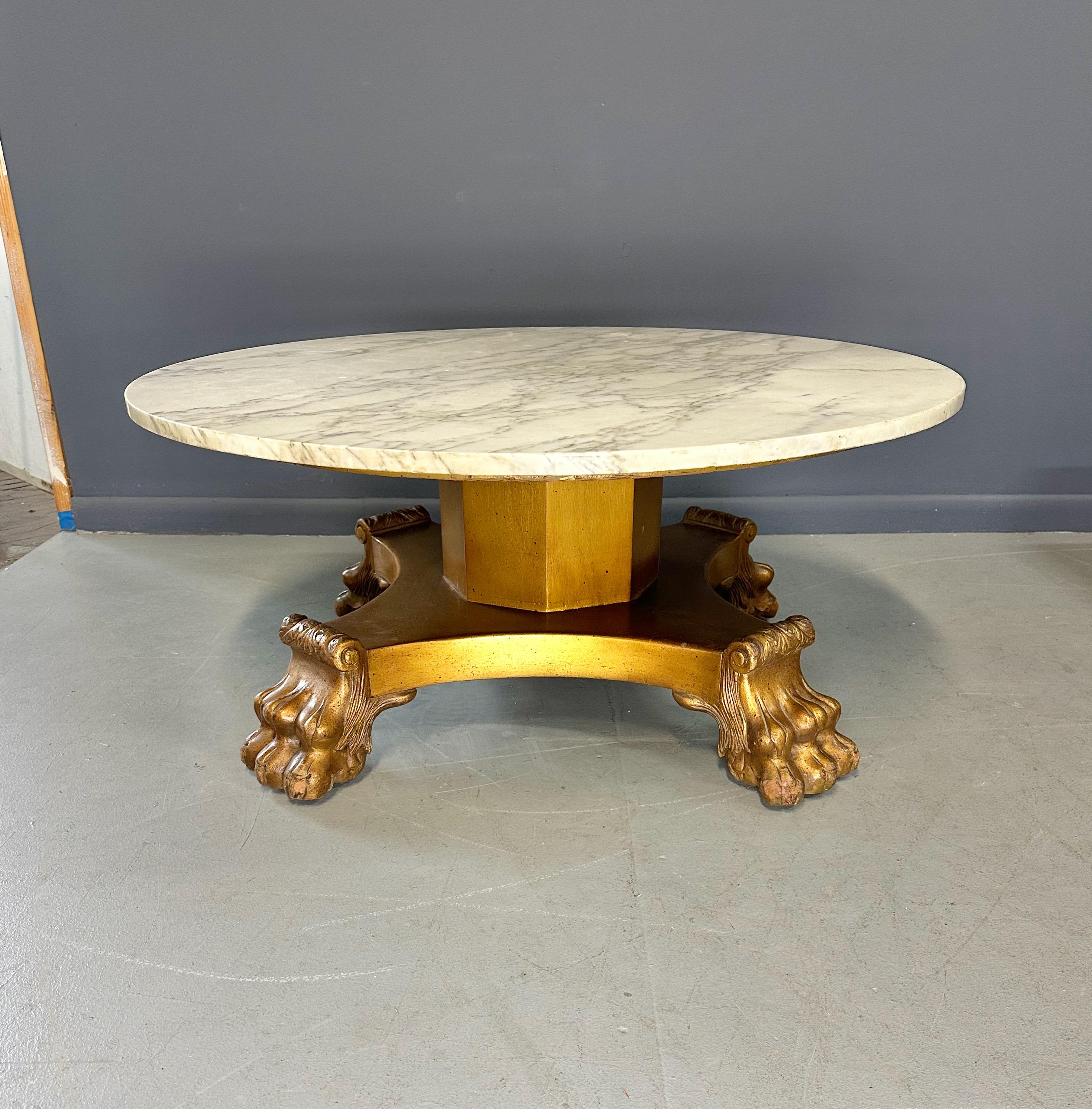 Enhance your living space with our 20th Century Empire Style Coffee Table. Crafted with a marble top and exquisite empire style lions paw leg design, this coffee table adds an elegant touch to any room. Featuring a sturdy construction, it is not