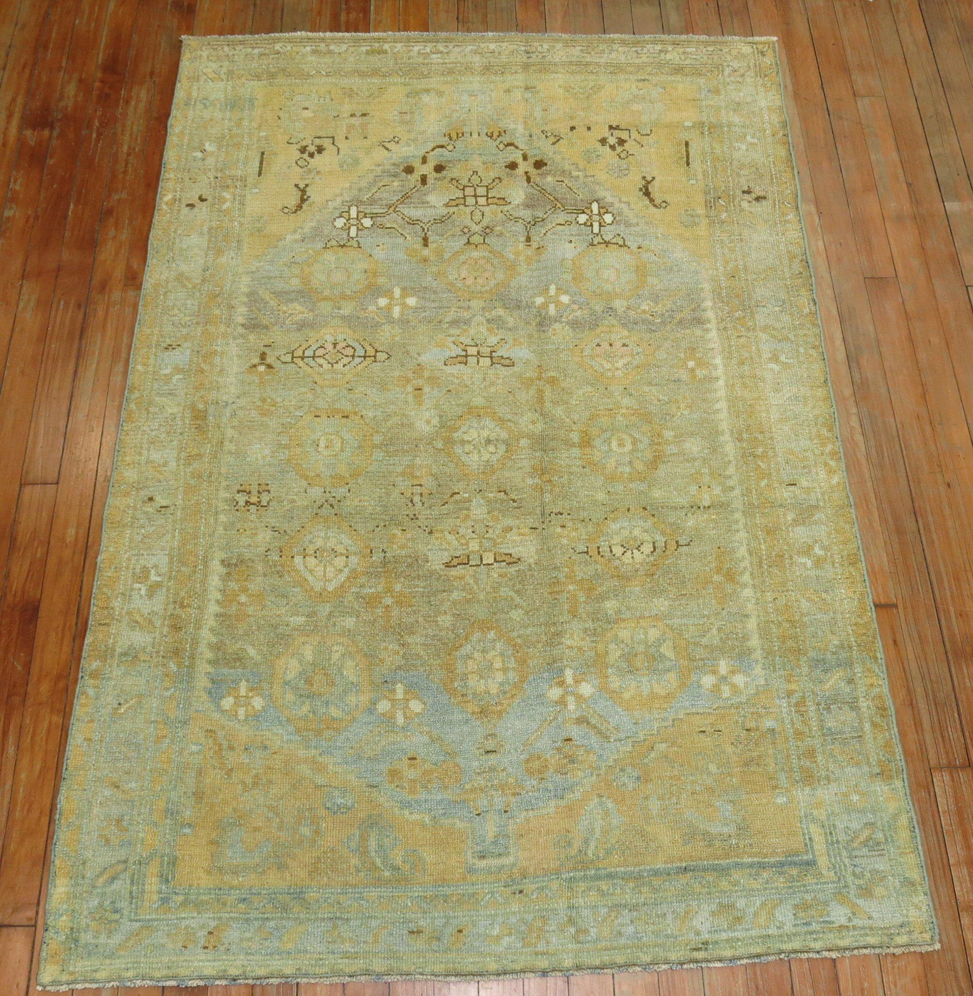 A throw size 20th century Persian Malayer rug with an all-over sun-faded mini-khani design in sand and light blue predominant accents

Measures: 3'7” x 5'3”.