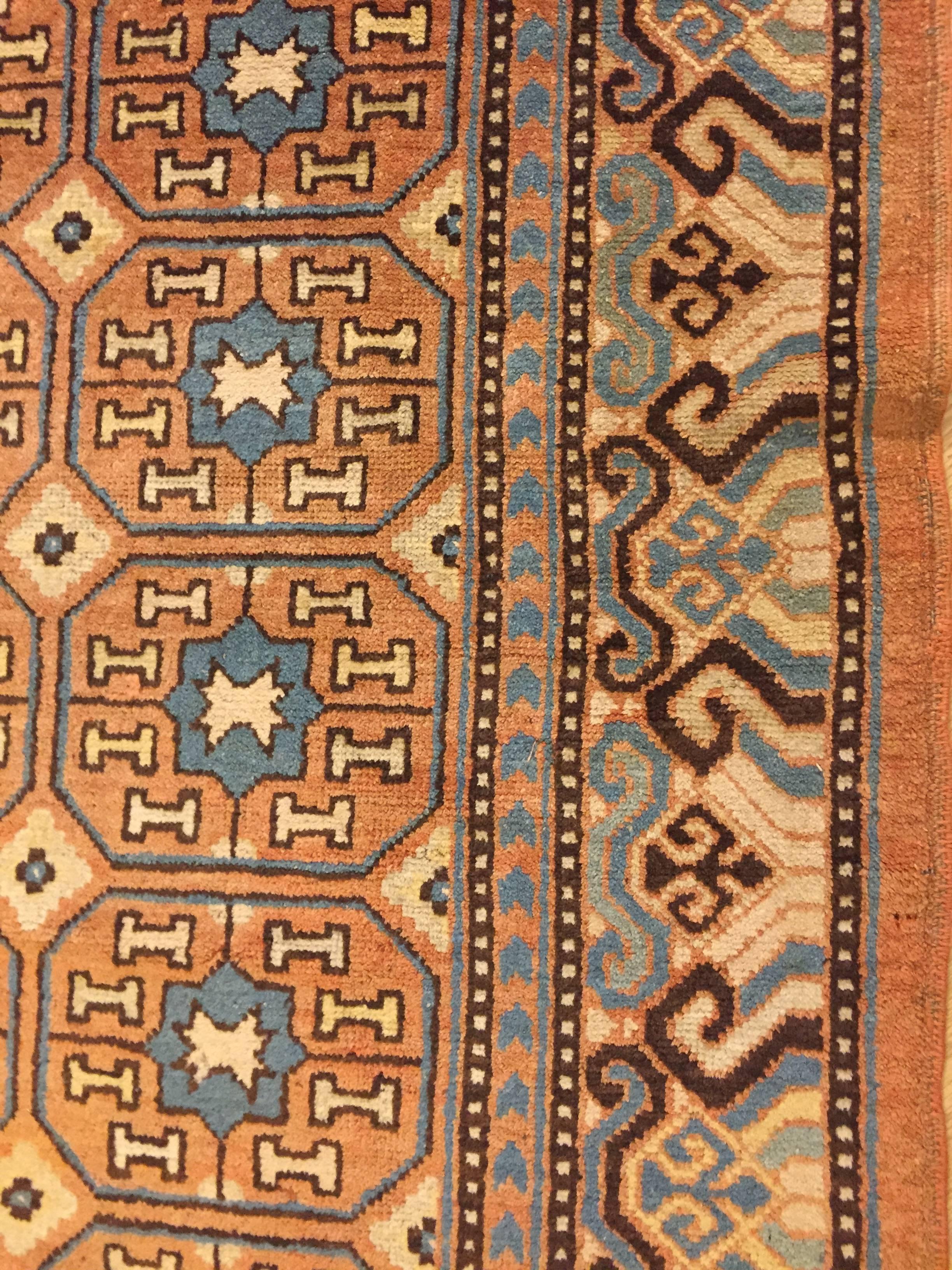 19th Century Brown and Blue Stylized Rosette Gul Chinese Khotan Rug, circa 1870s For Sale 5