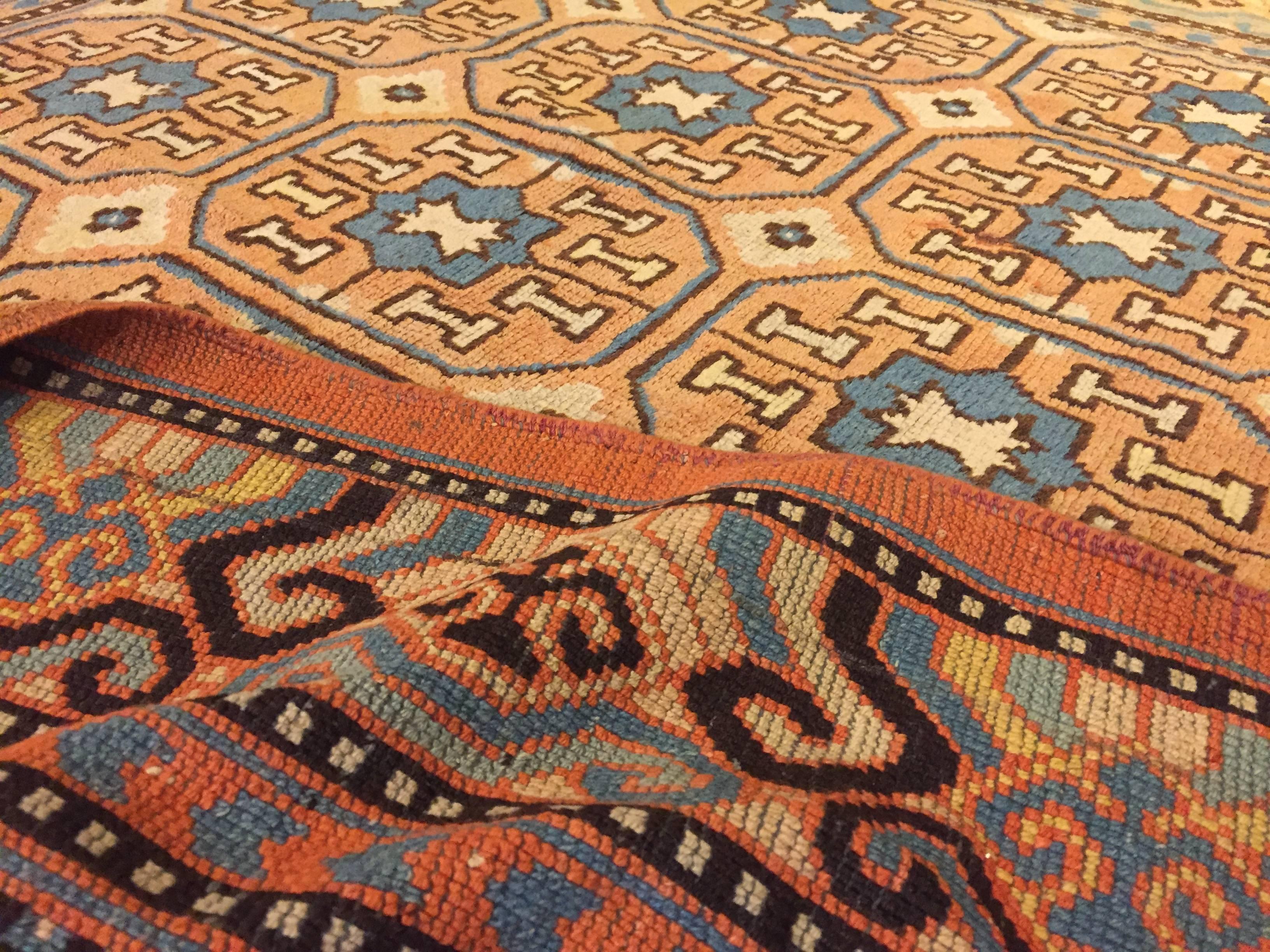 19th Century Brown and Blue Stylized Rosette Gul Chinese Khotan Rug, circa 1870s For Sale 7
