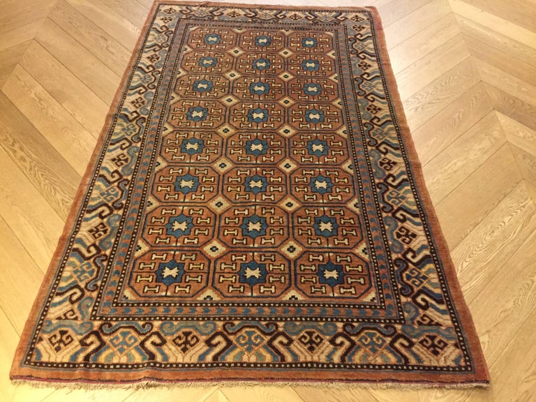 19th Century Brown and Blue Stylized Rosette Gul Chinese Khotan Rug ...