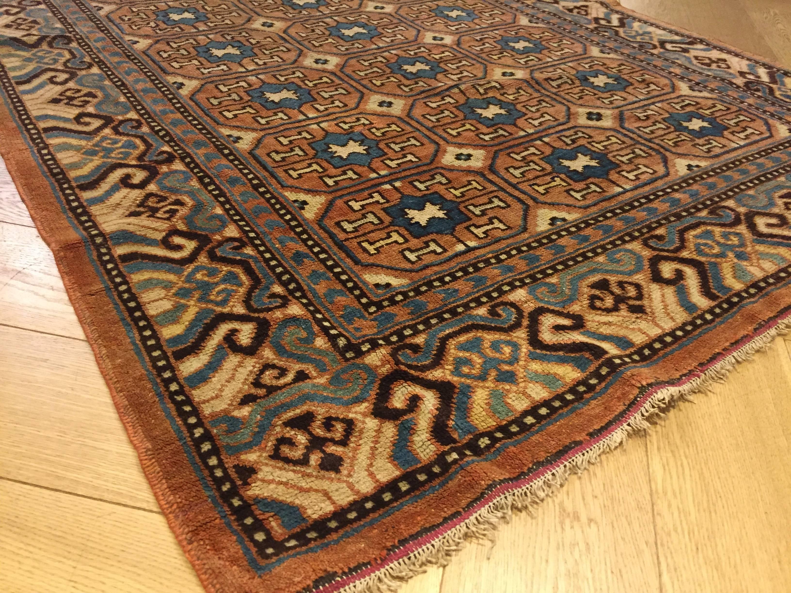 Chinoiserie 19th Century Brown and Blue Stylized Rosette Gul Chinese Khotan Rug, circa 1870s For Sale
